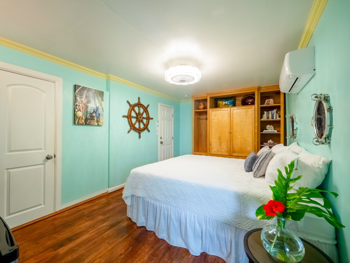 Hauula Vacation Rentals, Paradise Reef Retreat - Third bedroom with king-sized bed and flat screen TV enclosed cabinet