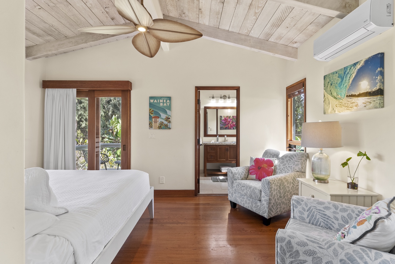 Haleiwa Vacation Rentals, Maluhia Beach House - Open and airy bedroom with a queen-size bed, garden views, and private lanai.