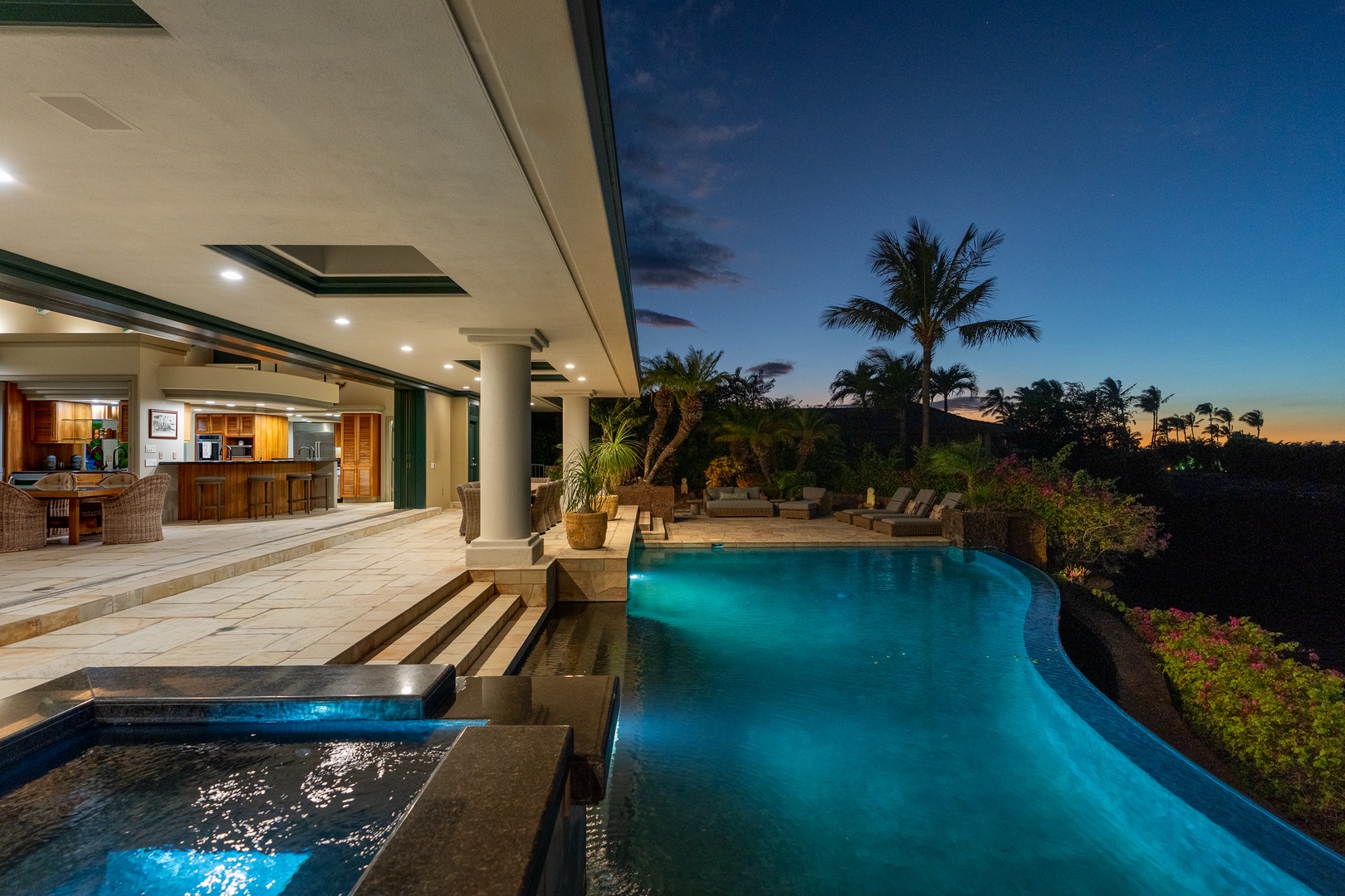 Kamuela Vacation Rentals, Champion Ridge 24 - Beautifully lit infinity pool and outdoor area at night, providing a serene space for evening relaxation.