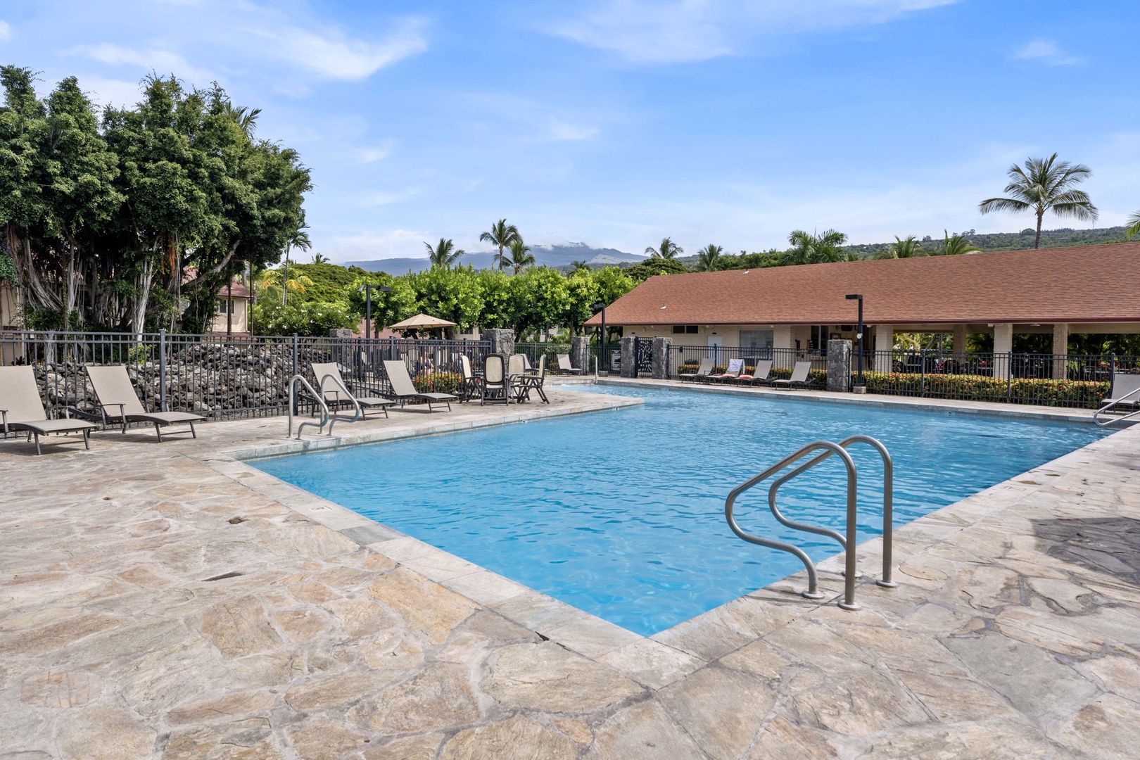 Kailua Kona Vacation Rentals, Keauhou Kona Surf & Racquet 1104 - Poolside chairs and quiet water, the low-key end of a beach day.