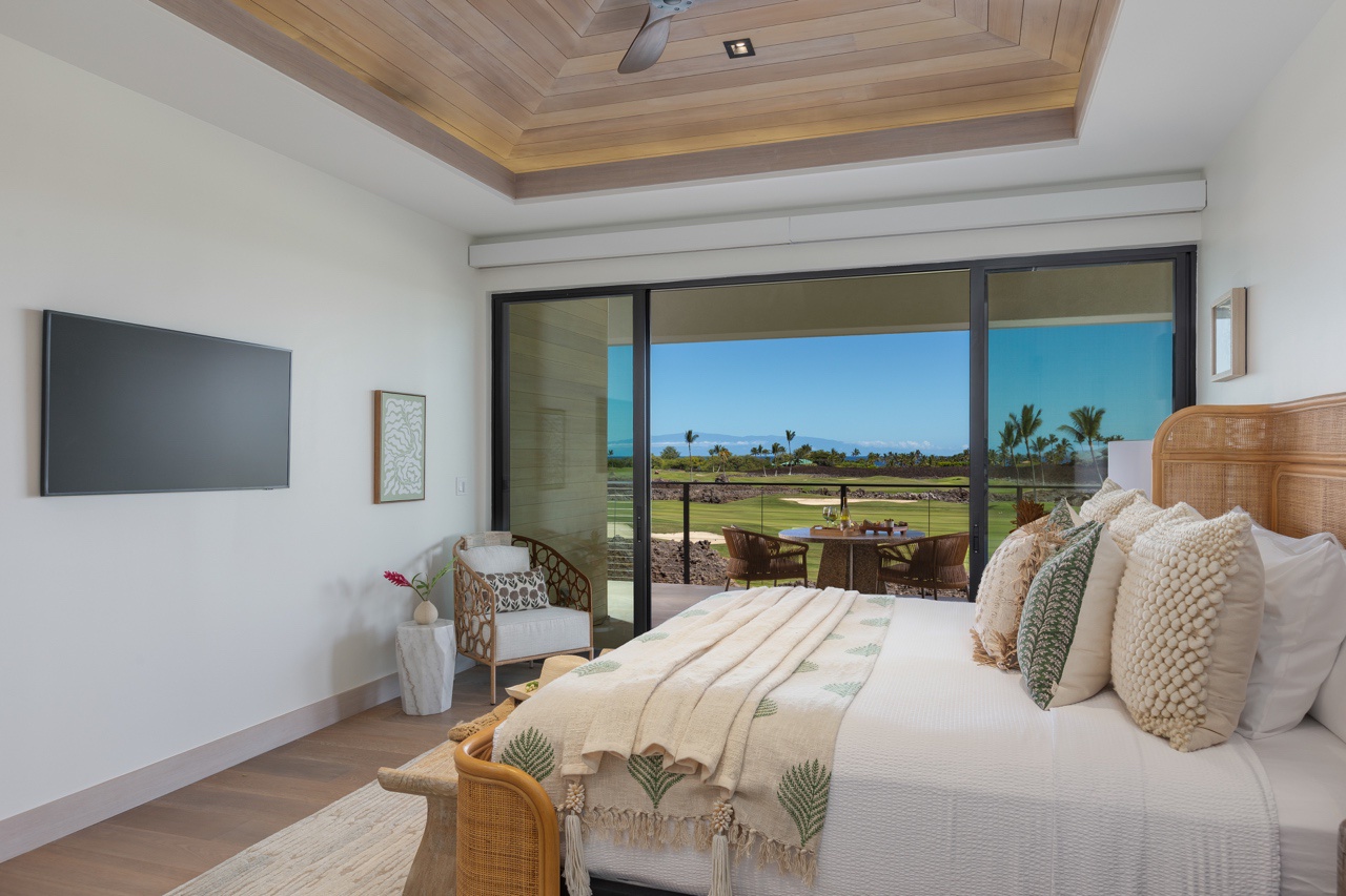 Waimea Vacation Rentals, 5BD Mauna Lani Lux Golf Estate (4) at One Ocean - This serene bedroom blends comfort with breathtaking views, featuring large sliding doors that open up to the lanai with a lush golf course landscape.