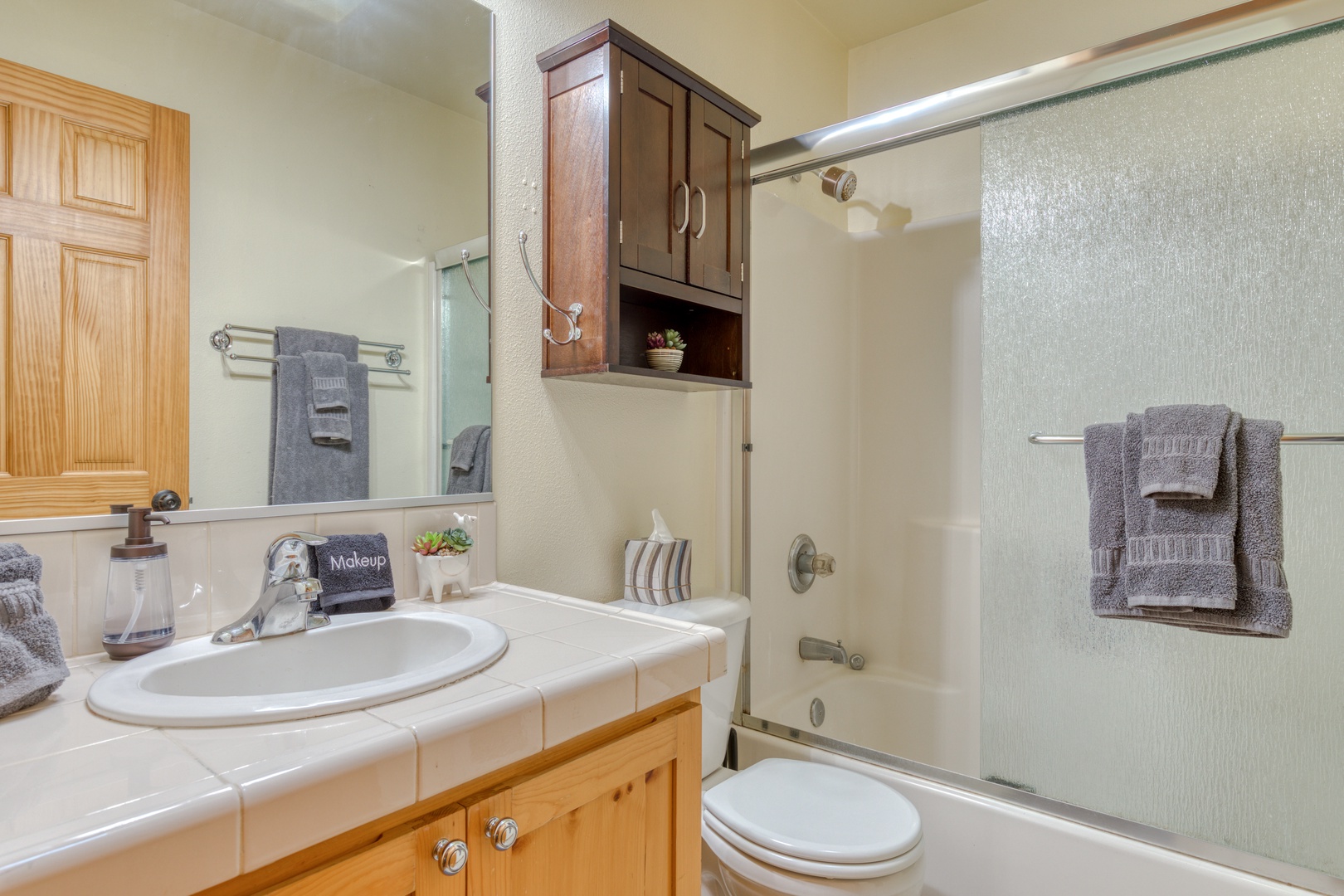 Brightwood Vacation Rentals, Riverside Retreat - Single vanity and shower/tub combo with sliding doors
