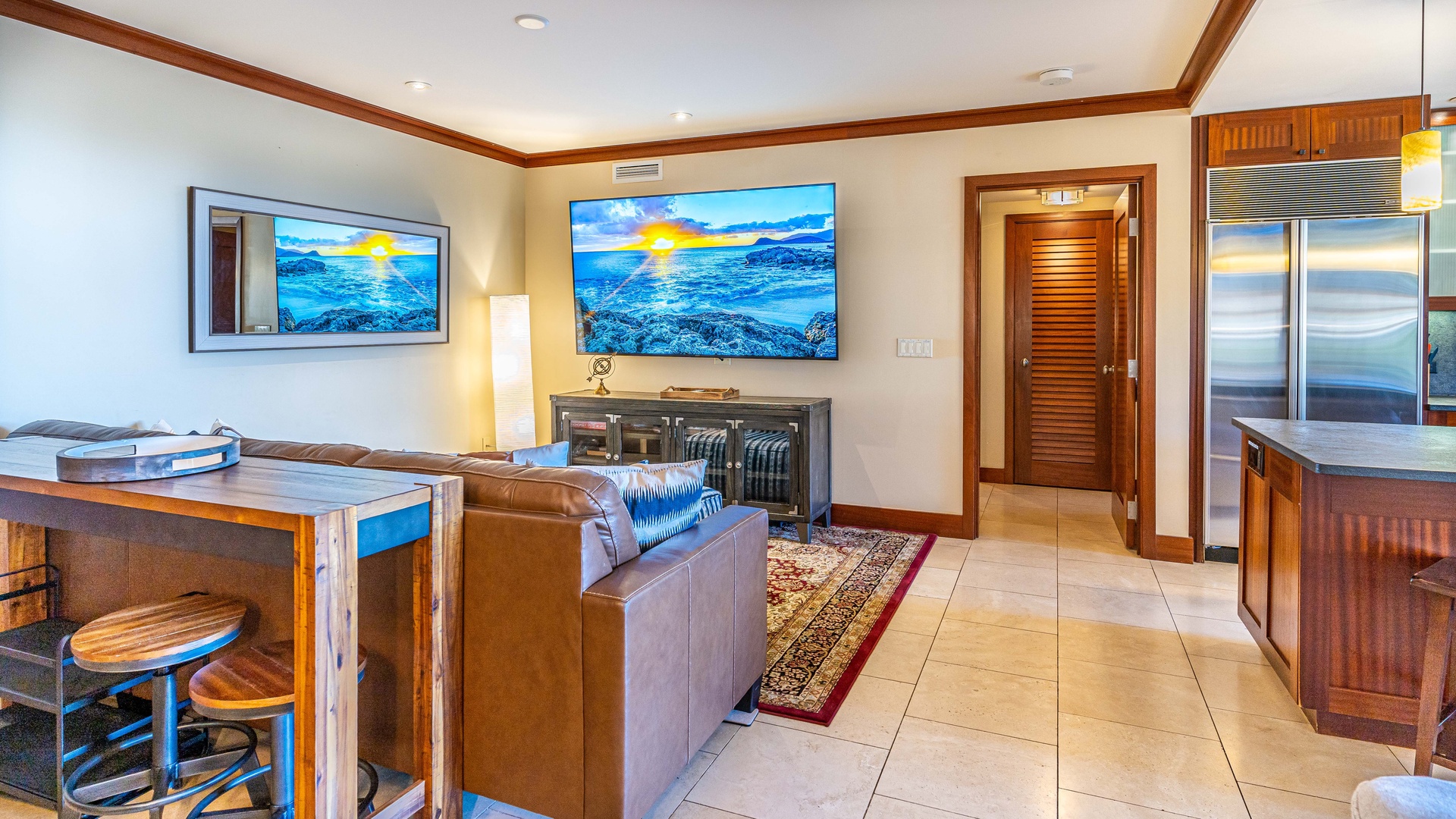 Kapolei Vacation Rentals, Ko Olina Beach Villas B102 - Another view of the living area with TV.