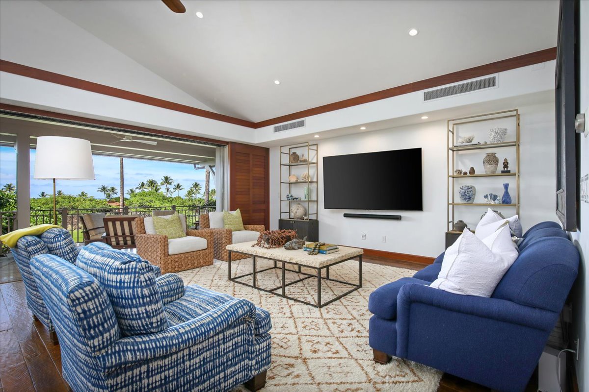 Kailua Kona Vacation Rentals, 3BD Ka'ulu Villa (129B) at Hualalai Resort - The living room offers a comfortable space with ample seating and a large TV, perfect for unwinding with loved ones.