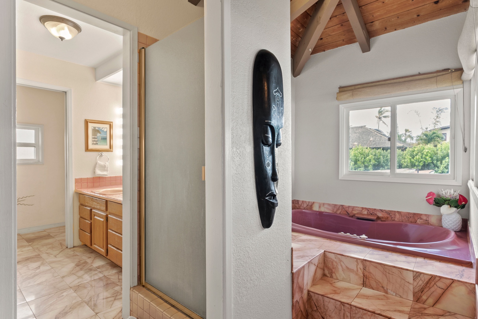 Haleiwa Vacation Rentals, North Shore Beachfront Retreat - Primary ensuite bathroom with a jacuzzi tub and stand up shower.