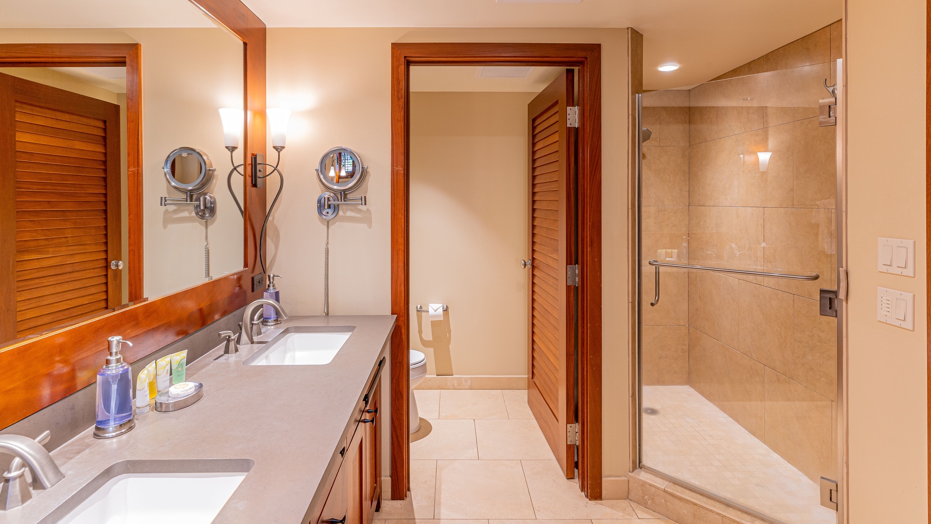 Kapolei Vacation Rentals, Ko Olina Beach Villas O224 - The primary guest bathroom with a walk-in shower and double vanity.