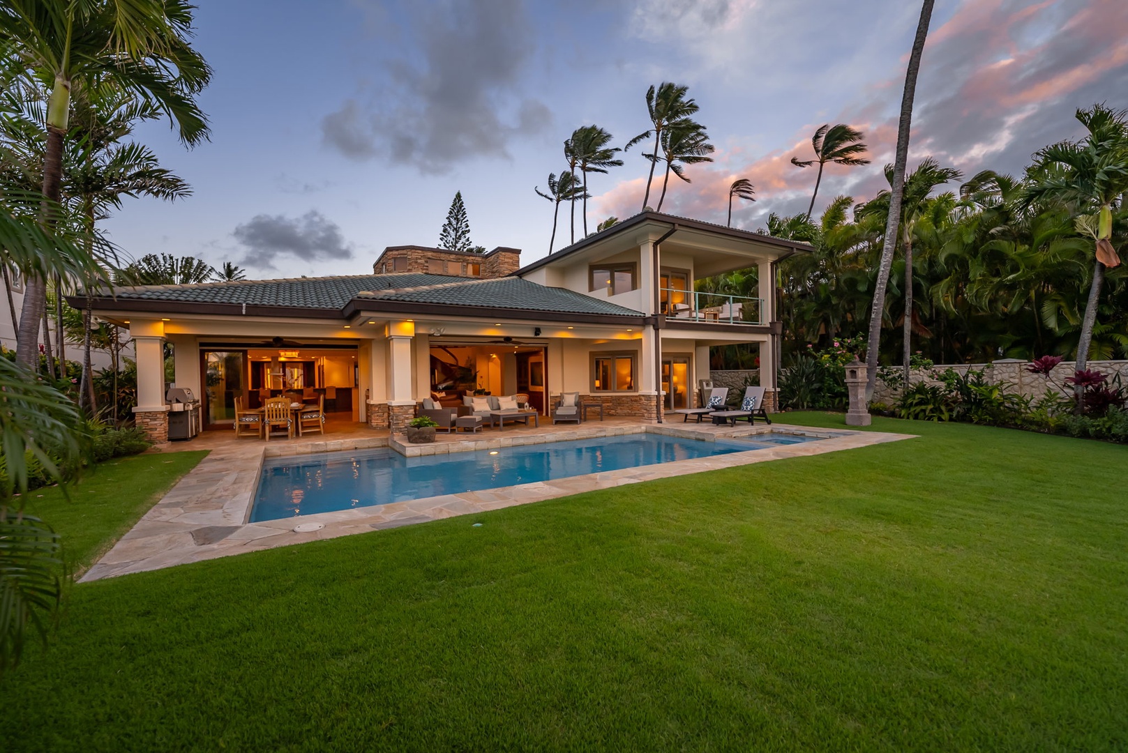 Honolulu Vacation Rentals, Maunalua Estate - Tropical landscaping, expansive outdoor spaces, and coastal views capture the ease of beachfront living.
