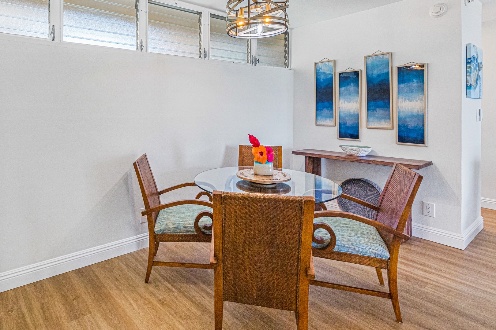 Lahaina Vacation Rentals, Royal Kahana 213 - Charming dining area with a glass-top table and comfortable seating for four, perfect for casual meals or intimate gatherings.