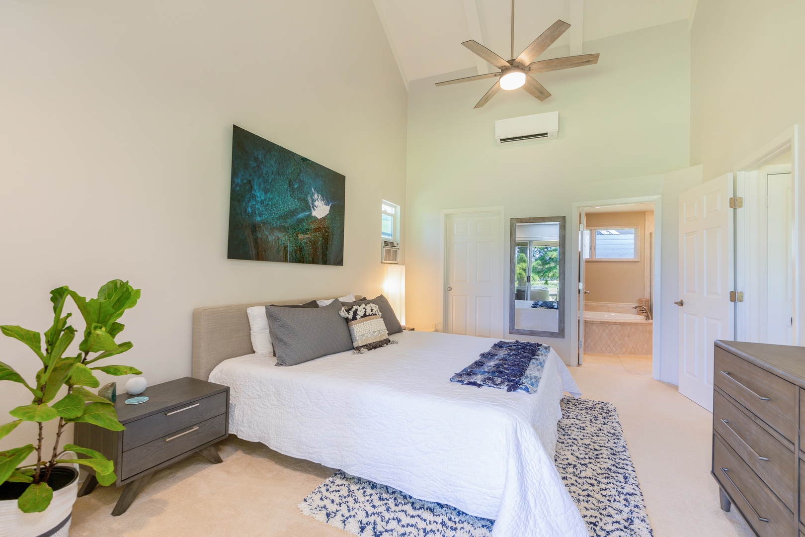 Princeville Vacation Rentals, Wai Puna - Primary bedroom with king, golf views, lanai access, and ensuite bathroom