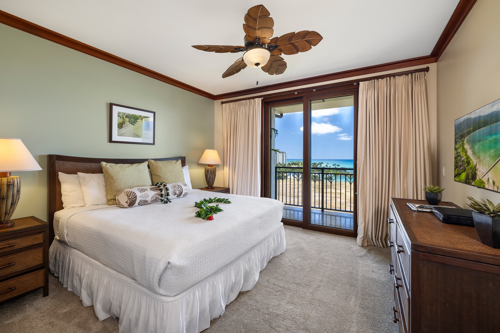Kapolei Vacation Rentals, Ko Olina Beach Villas B901 - Wake to stunning ocean views from your private balcony in this tropical-themed bedroom, complete with ceiling fan and peaceful ambiance.