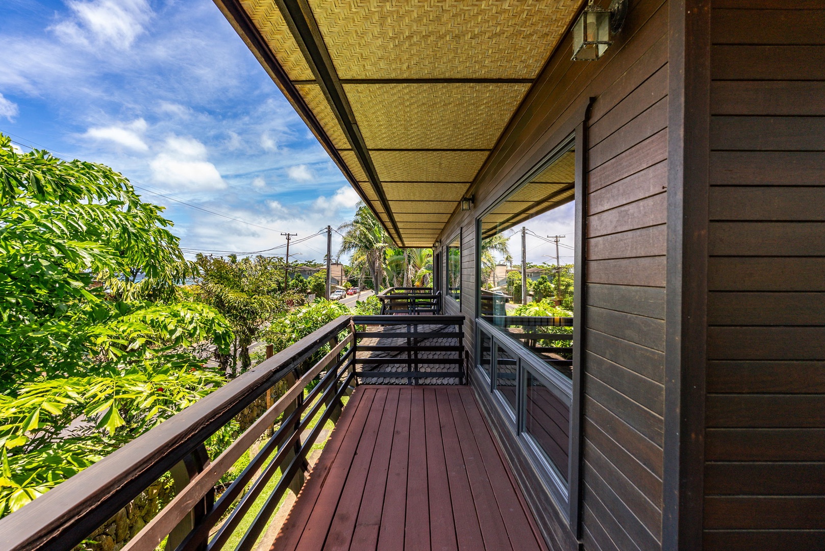 Haleiwa Vacation Rentals, Kealoha Tropical Beach Villa - The wrap around deck is accessible through the living area.