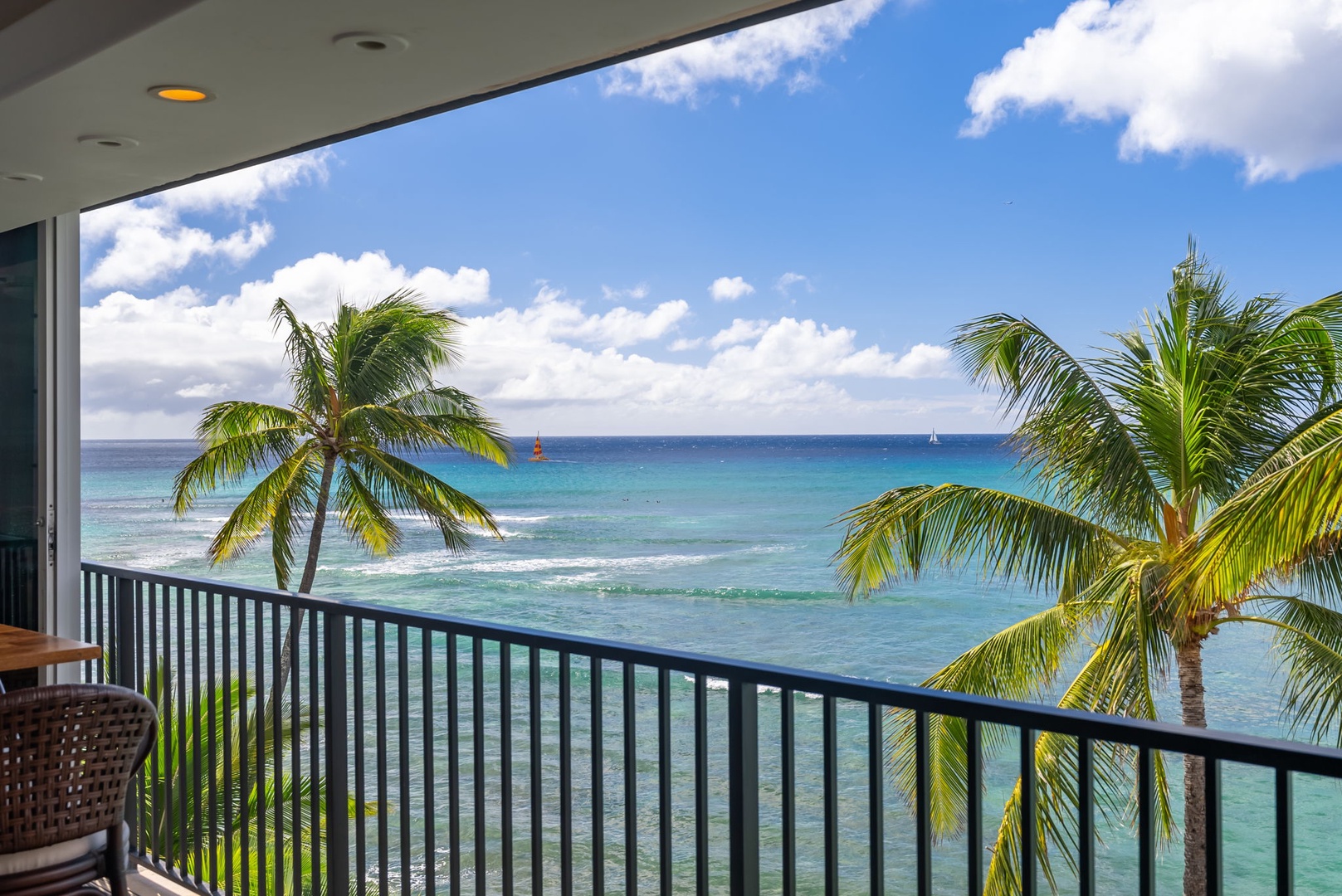 Honolulu Vacation Rentals, Kaimana Beach Penthouse - "Expansive oceanfront views from your balcony—immerse yourself in the beauty of swaying palms and endless blue waters
