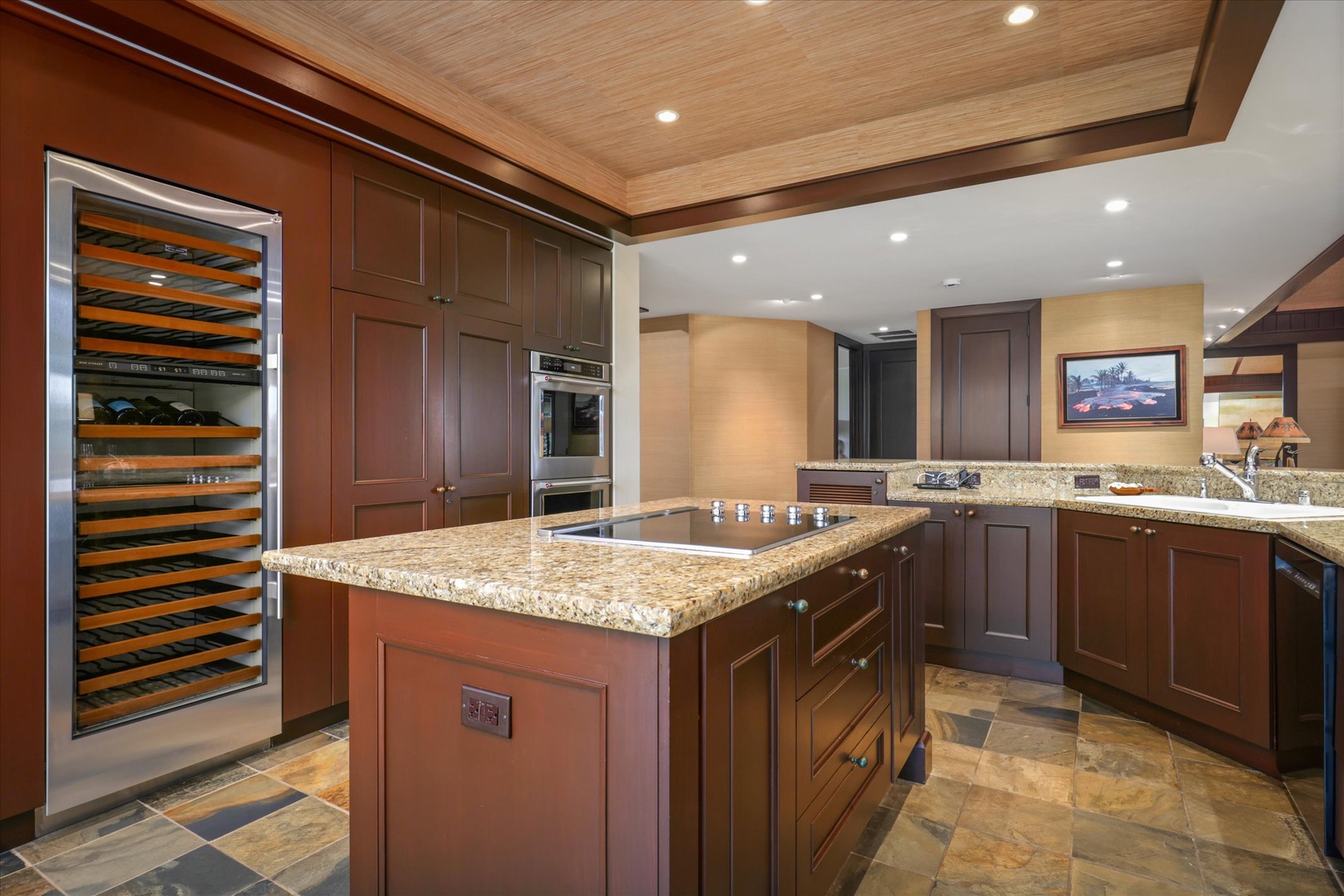 Kailua Kona Vacation Rentals, Wai'ulu Villa 115D - Expansive kitchen island with granite counters and premium appliances—function meets refined design.