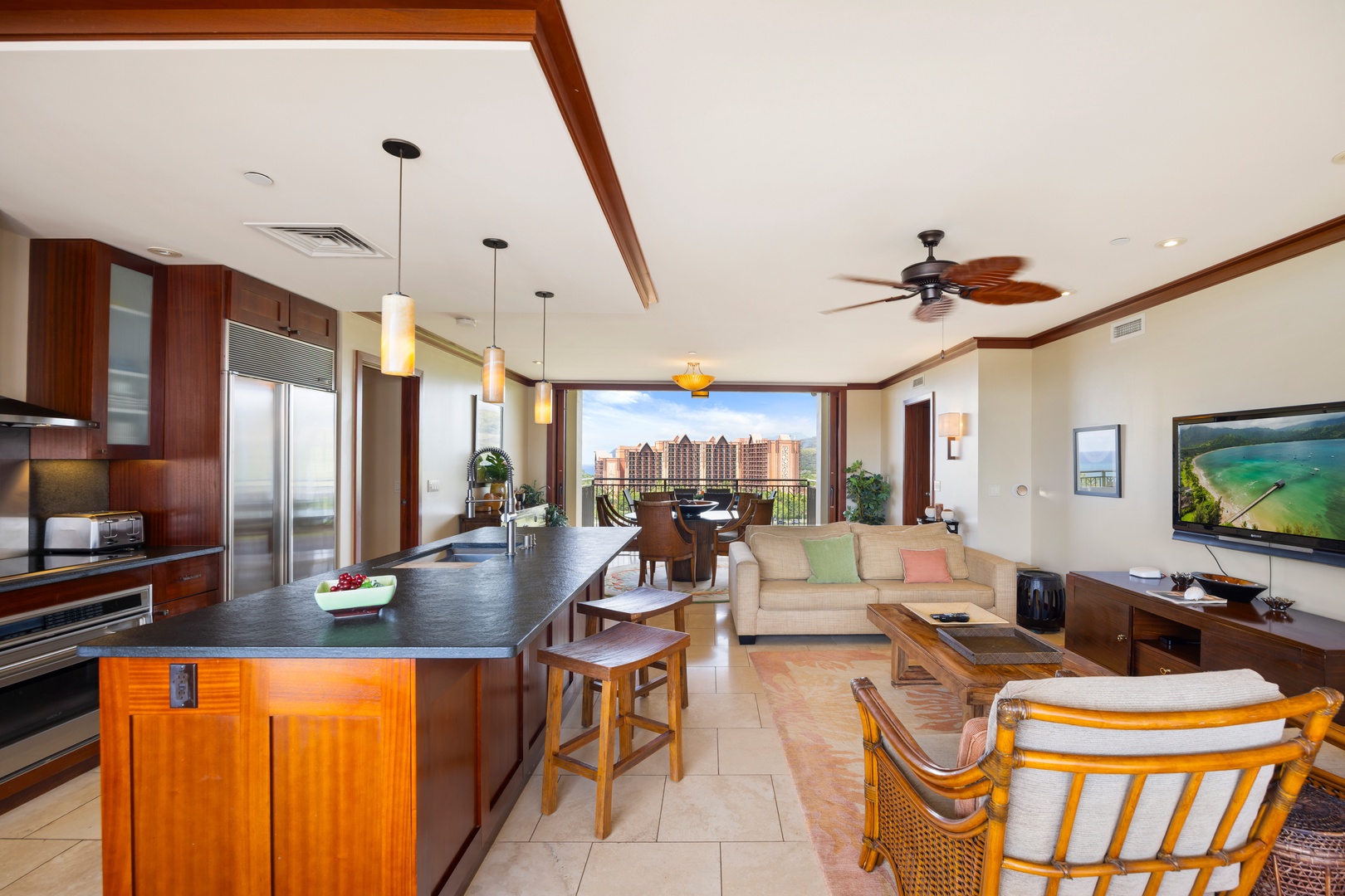 Kapolei Vacation Rentals, Ko Olina Beach Villas O1111 - Your luxury island escape features an open kitchen, elegant dining space, and city views through floor-to-ceiling windows.