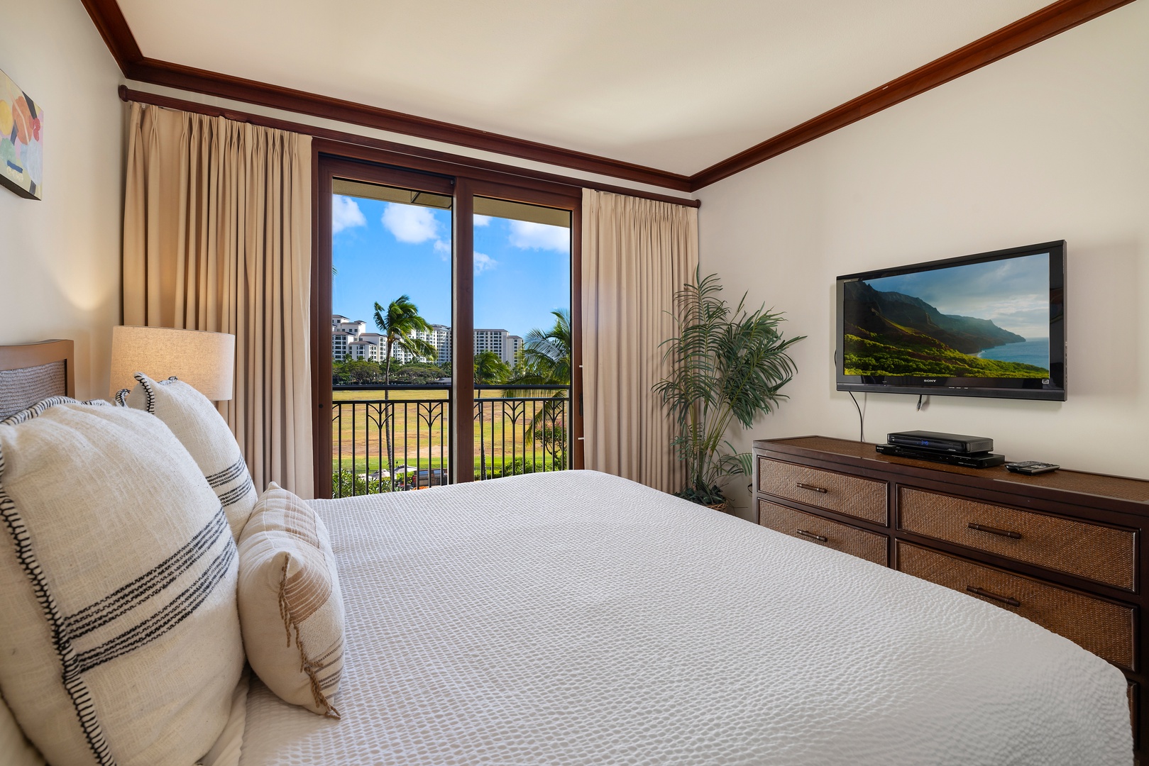Kapolei Vacation Rentals, Ko Olina Beach Villas B403 - Wake up to stunning tropical views from your comfortable bed, with warm wood accents and a private balcony overlooking lush landscapes.