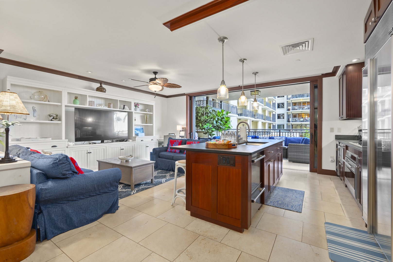 Cooking, lounging, and lanai time flow together in one open space, keeping everyone connected.