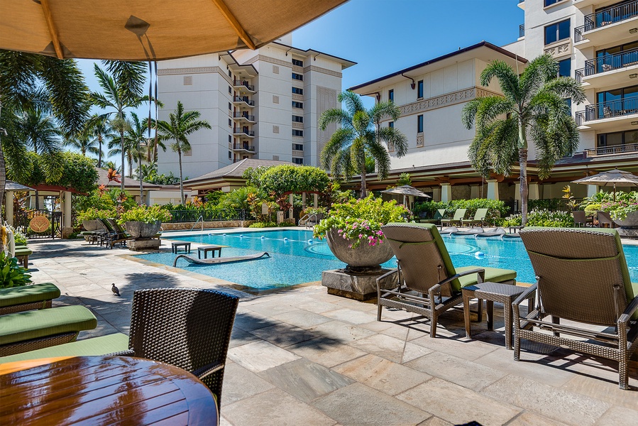 Kapolei Vacation Rentals, Ko Olina Beach Villas B210 - Resort pool with shaded lounge seating.