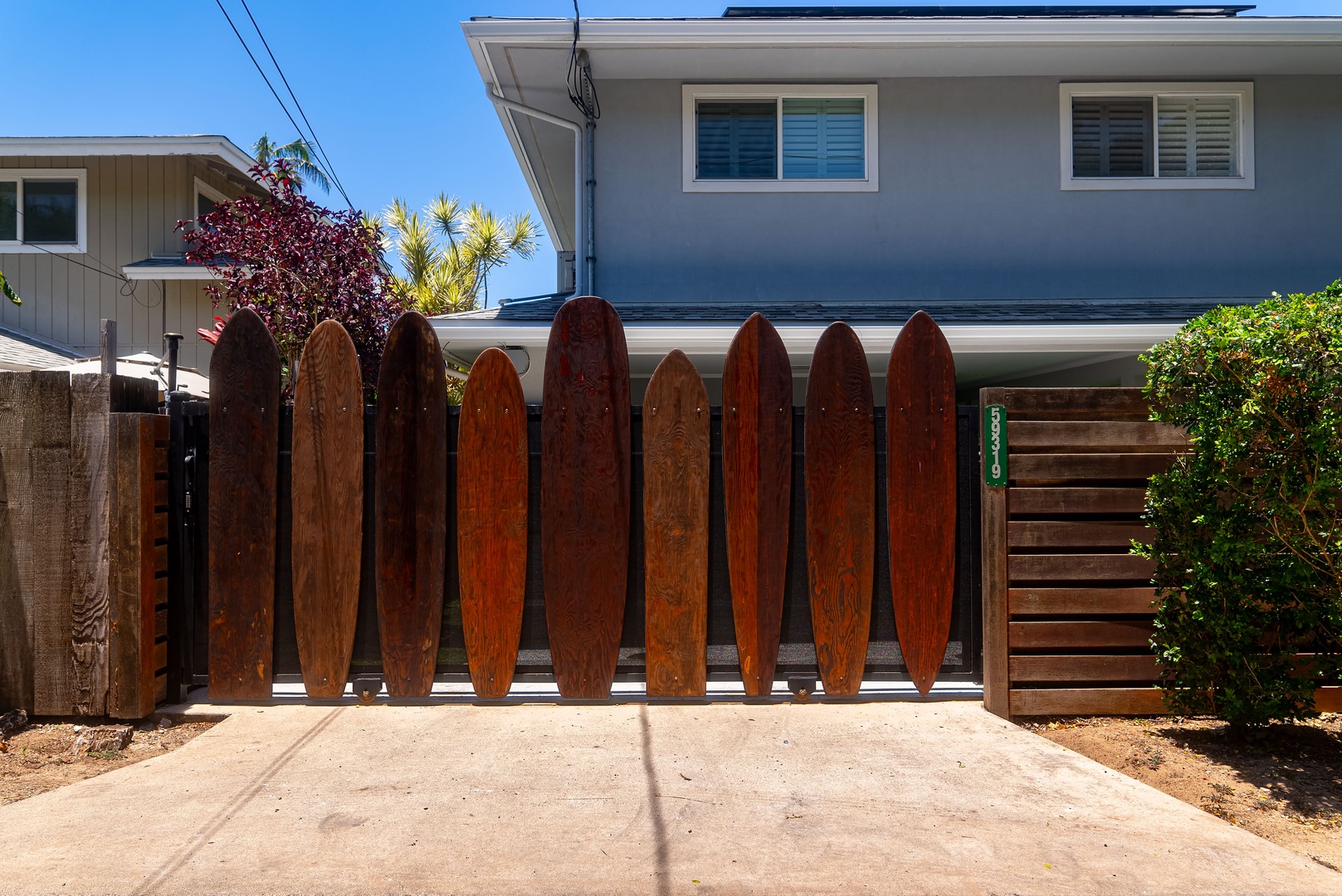 Haleiwa Vacation Rentals, Hale Nalu - Surfboard gate welcomes you to your North Shore escape.