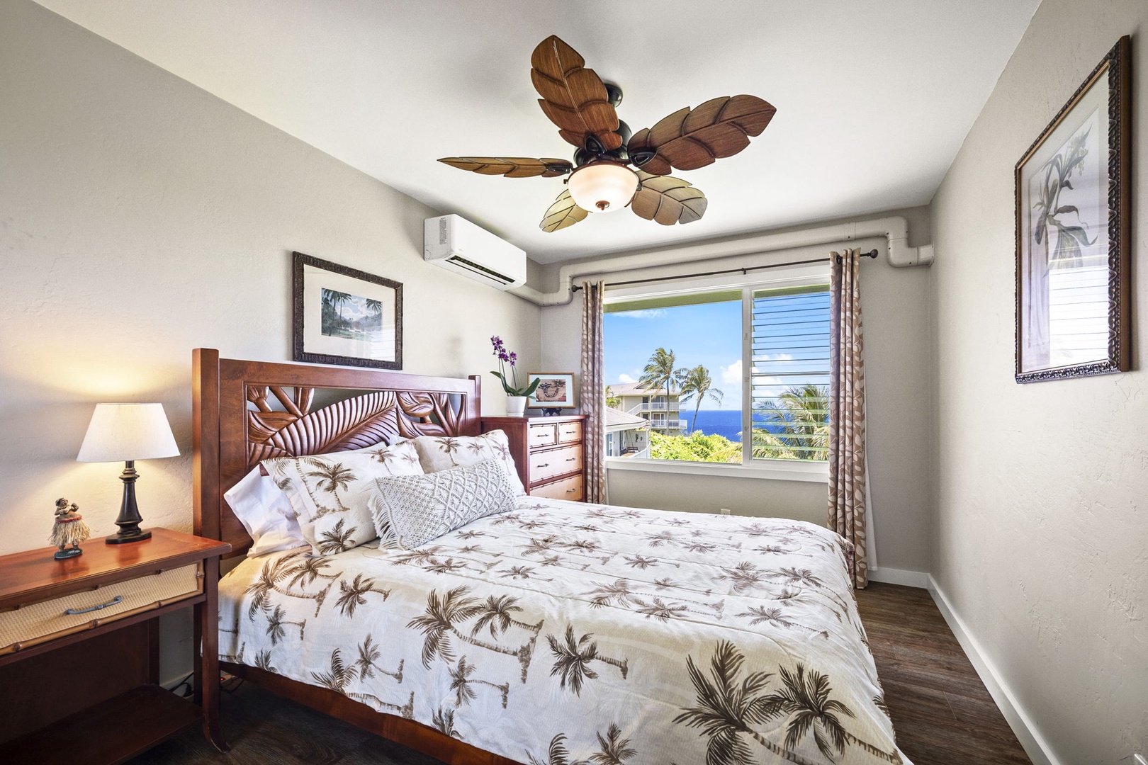 Princeville Vacation Rentals, Alii Kai 7201 - Wake to the ocean framed in the window from a bed dressed in island prints.