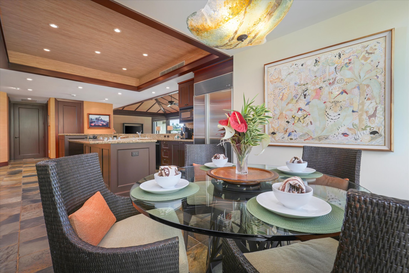Kailua Kona Vacation Rentals, Wai'ulu Villa 115D - Formal dining with custom lighting and curated art—entertain in style beneath warm wood finishes.