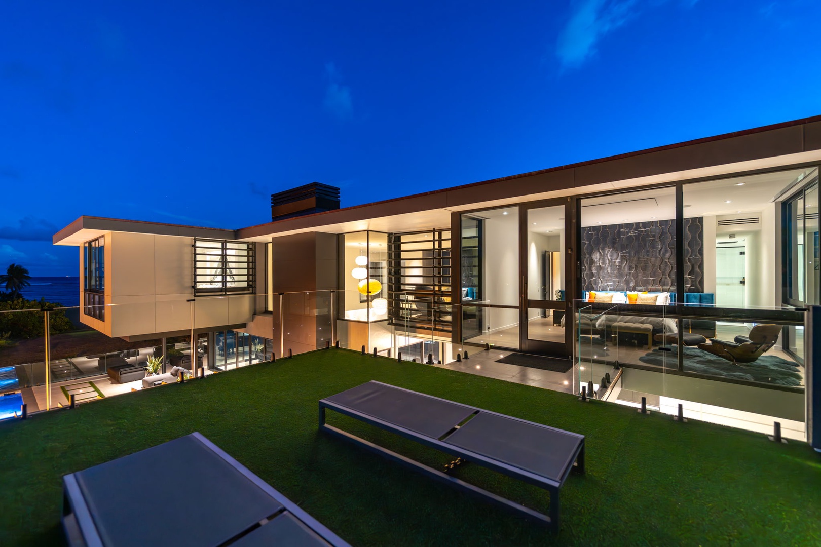 Honolulu Vacation Rentals, Ocean Villa Emilie - Lounge in the grassy backyard with panoramic views and soft evening breezes as your backdrop.