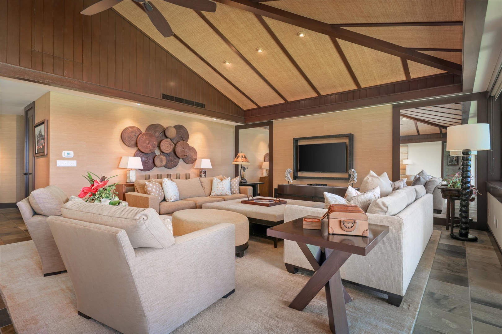 Kailua Kona Vacation Rentals, Wai'ulu Villa 115D - Evening glow and custom lighting elevate the elegant open-concept space—comfort with artistic flair.