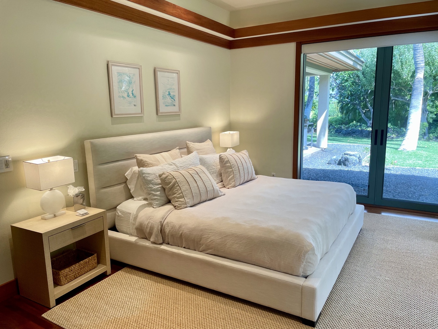 Kamuela Vacation Rentals, Champion Ridge Oasis - Primary bedroom showcasing lush garden views and natural light. This bedroom sits at the opposite end of the home from the other two guest suites, offering the ultimate in privacy and comfort.