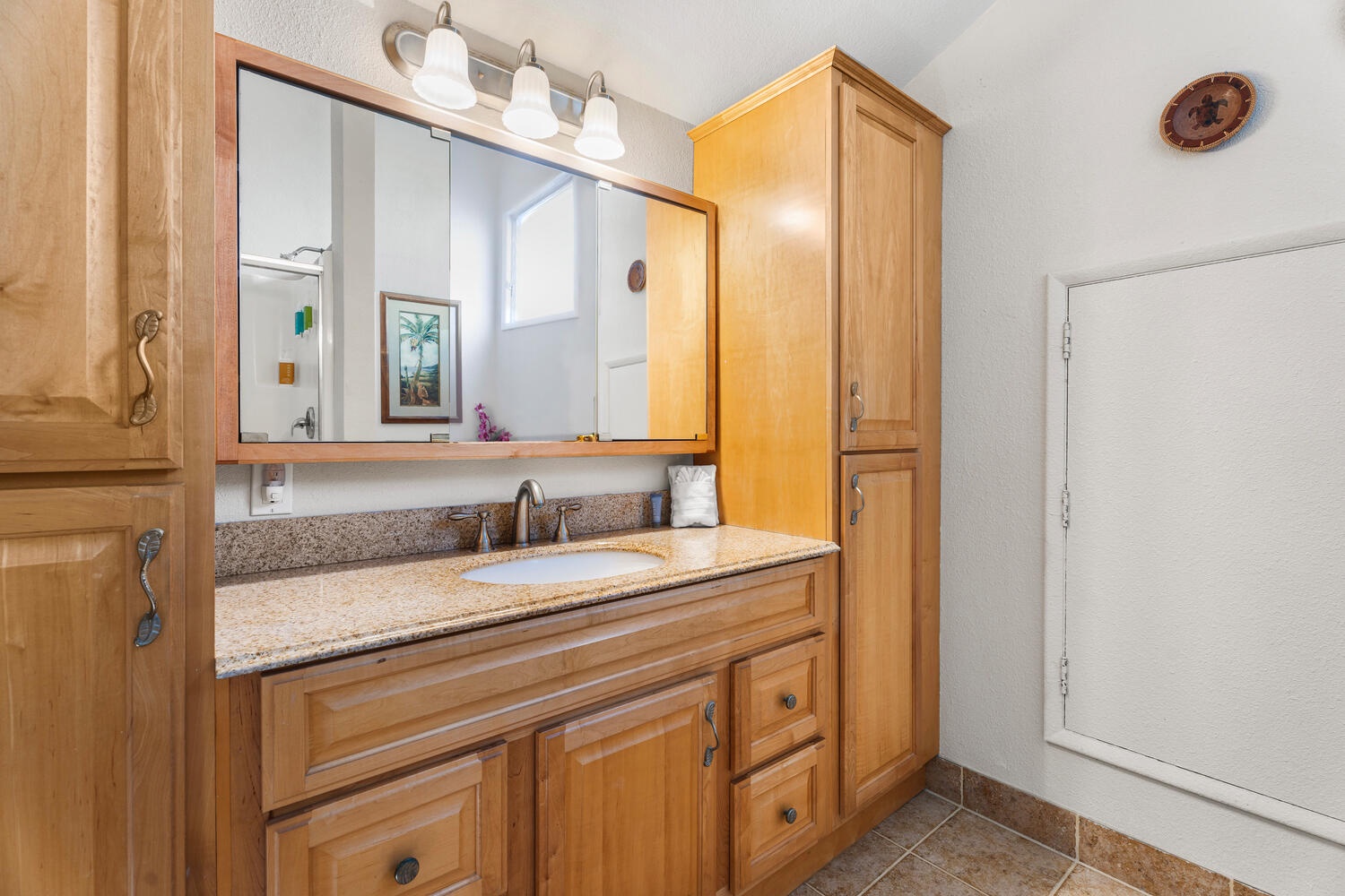 Kailua Kona Vacation Rentals, Kanaloa at Kona 3304 - Third full bathroom with generous vanity and natural wood cabinetry.