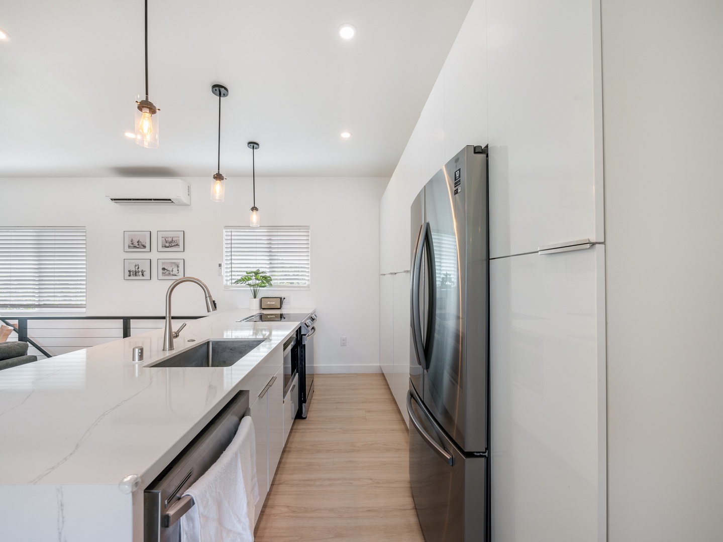 Haleiwa Vacation Rentals, Sunset Beach Island Retreat - Stainless steel appliances complement the clean, minimalist look, making this kitchen both functional and stylish.