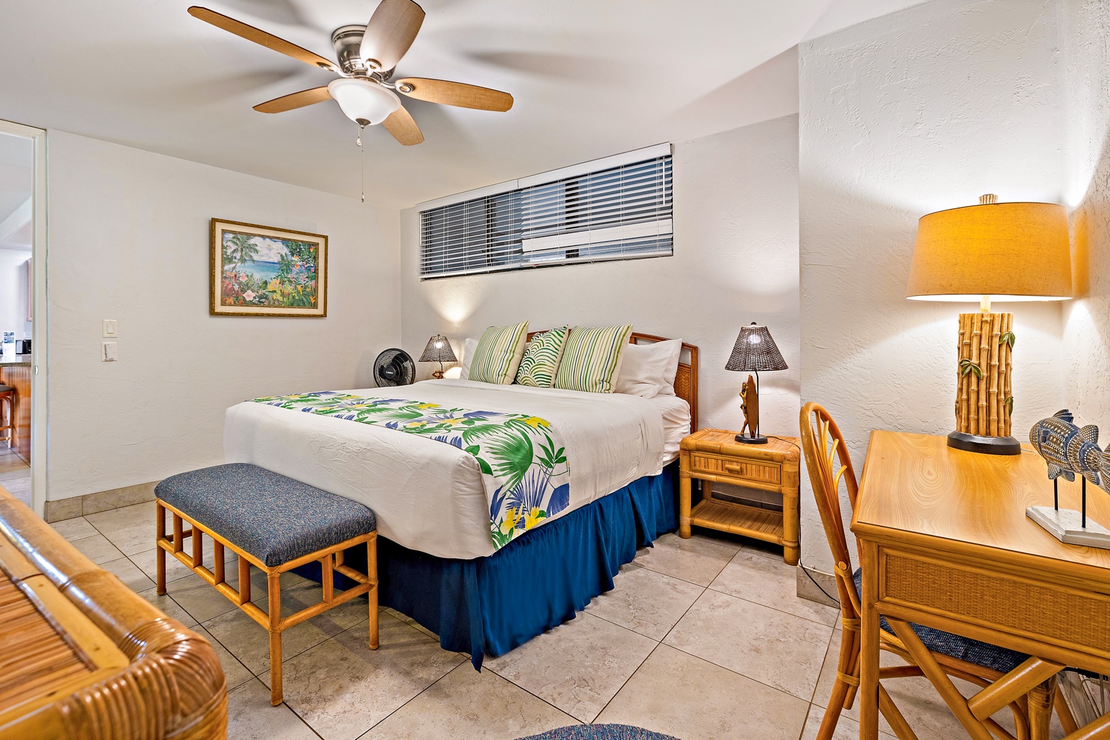 Lahaina Vacation Rentals, Papakea K-105 - The bedroom offers a king-sized bed with tropical accents and a dedicated workspace