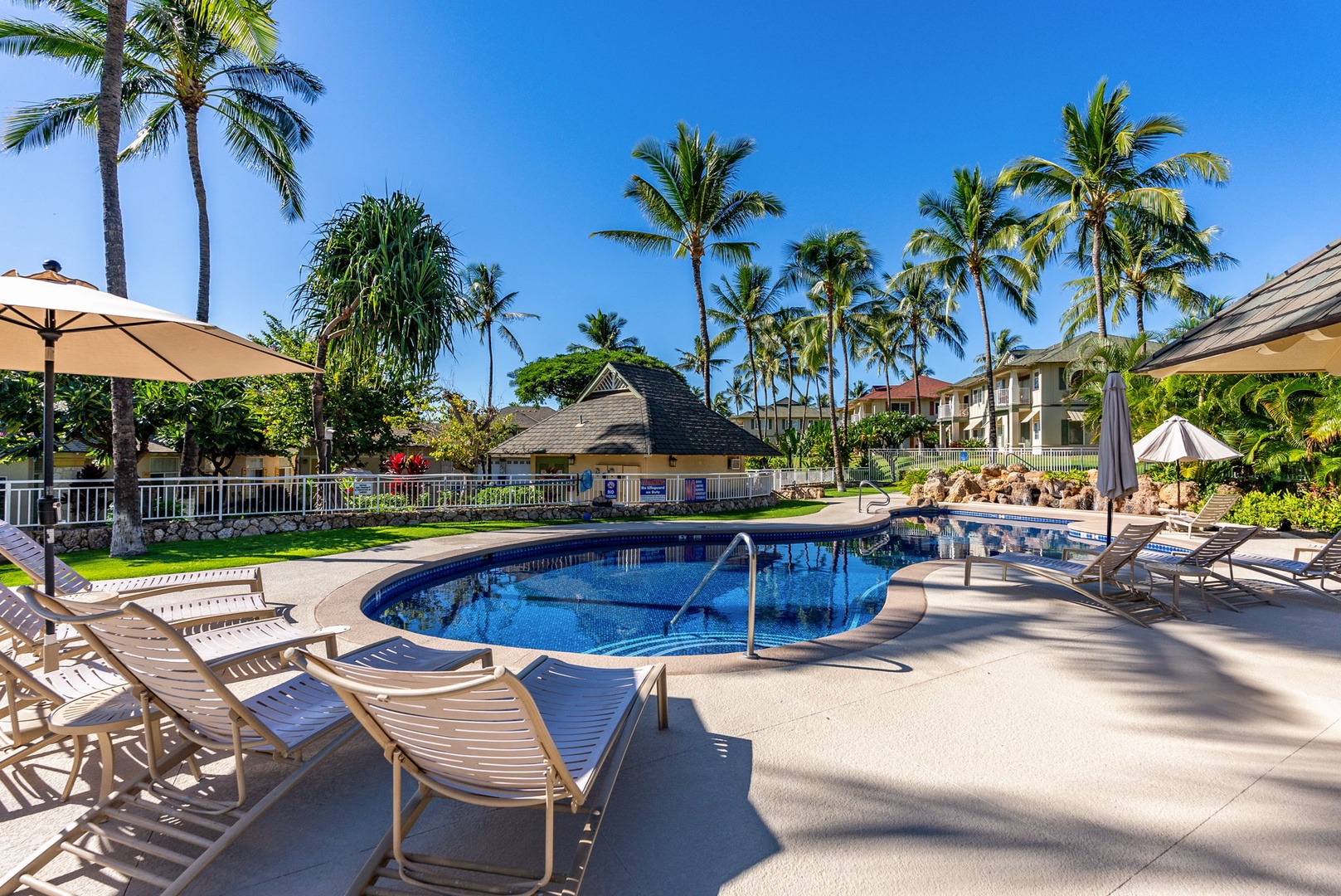 Kapolei Vacation Rentals, Kai Lani Luxury 6D - Inviting poolside seating area with a shaded thatched roof, a comfortable spot for lounging out of the sun.