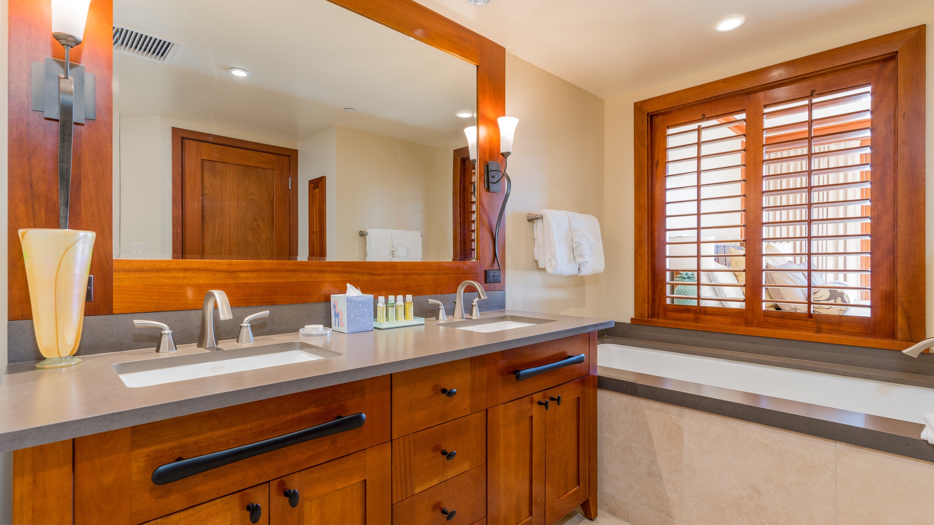 Kapolei Vacation Rentals, Ko Olina Beach Villas B309 - The primary guest bathroom with a soaking tub for luxurious relaxation.