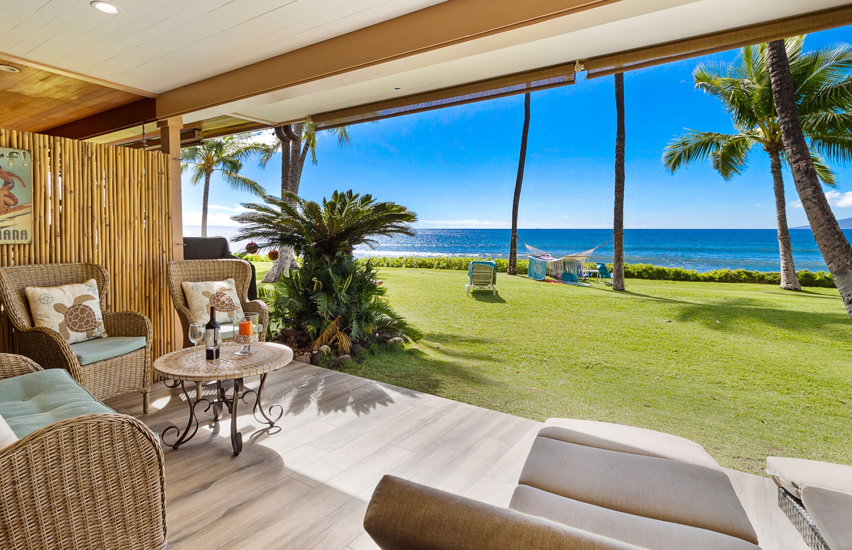 Lahaina Vacation Rentals, Puamana 240-3 - Experience outdoor living at its best with a lanai offering stunning vistas of palm trees and the sea.