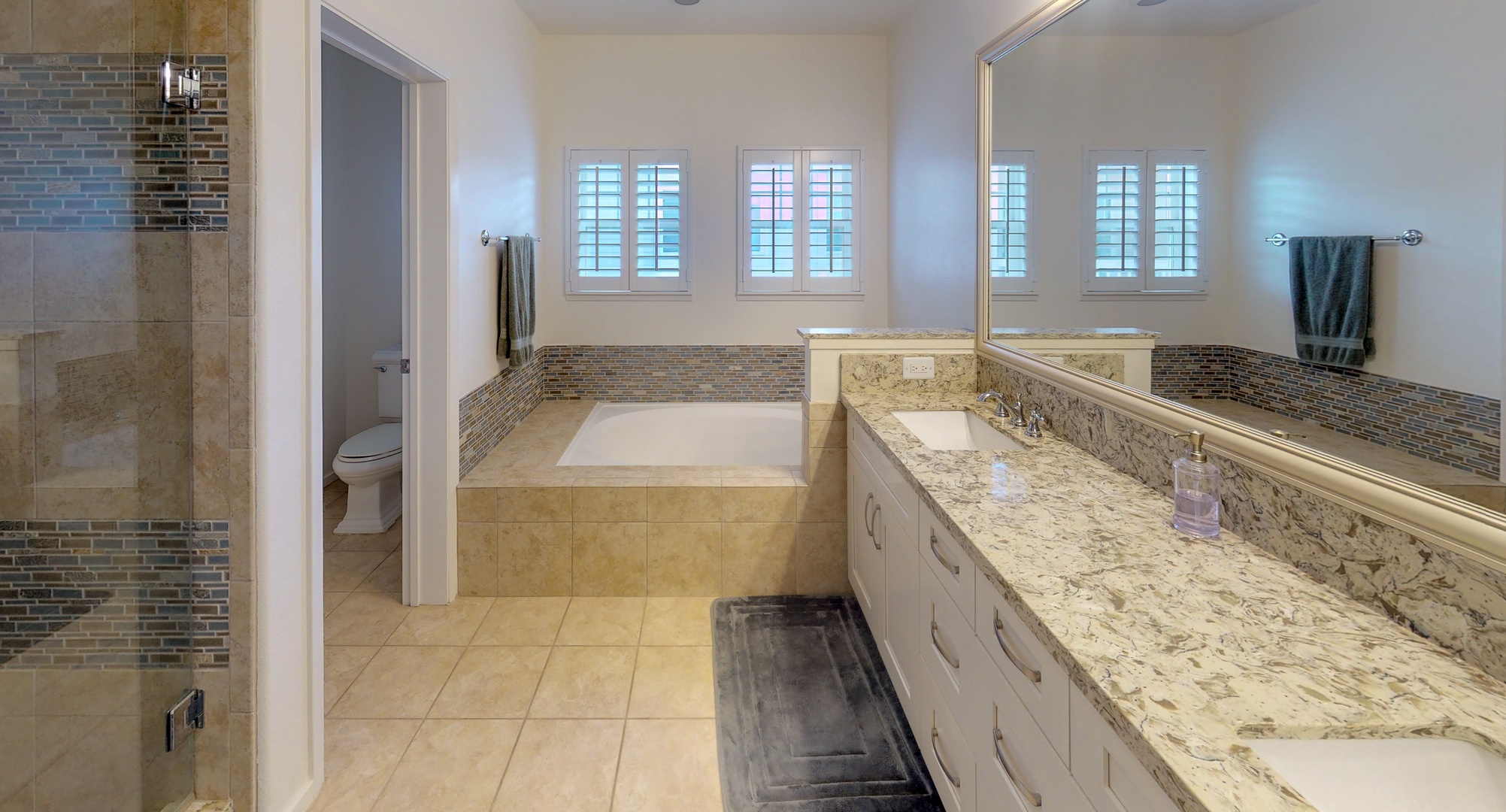 Kapolei Vacation Rentals, Coconut Plantation 1158-1 - The spacious primary guest bathroom with a luxurious soaking tub.