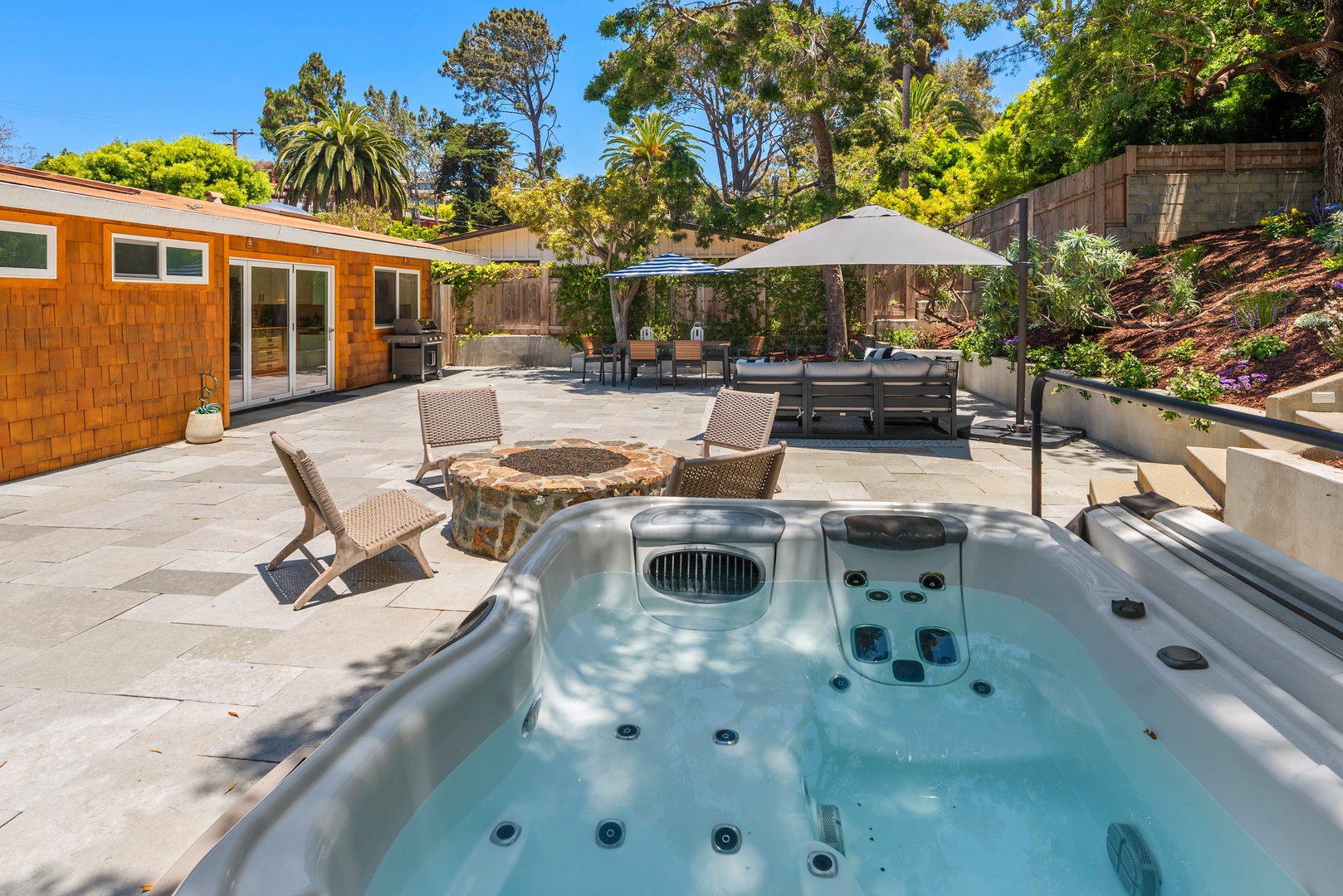 Del Mar Vacation Rentals, Del Mar Zuni Delight - the real magic of this home lies in its indoor/outdoor living spaces. Lanai doors open to a large front deck with ocean views, while a large private backyard provides wonderful privacy and features a hot tub, fire pit, BBQ, and outdoor dining area.