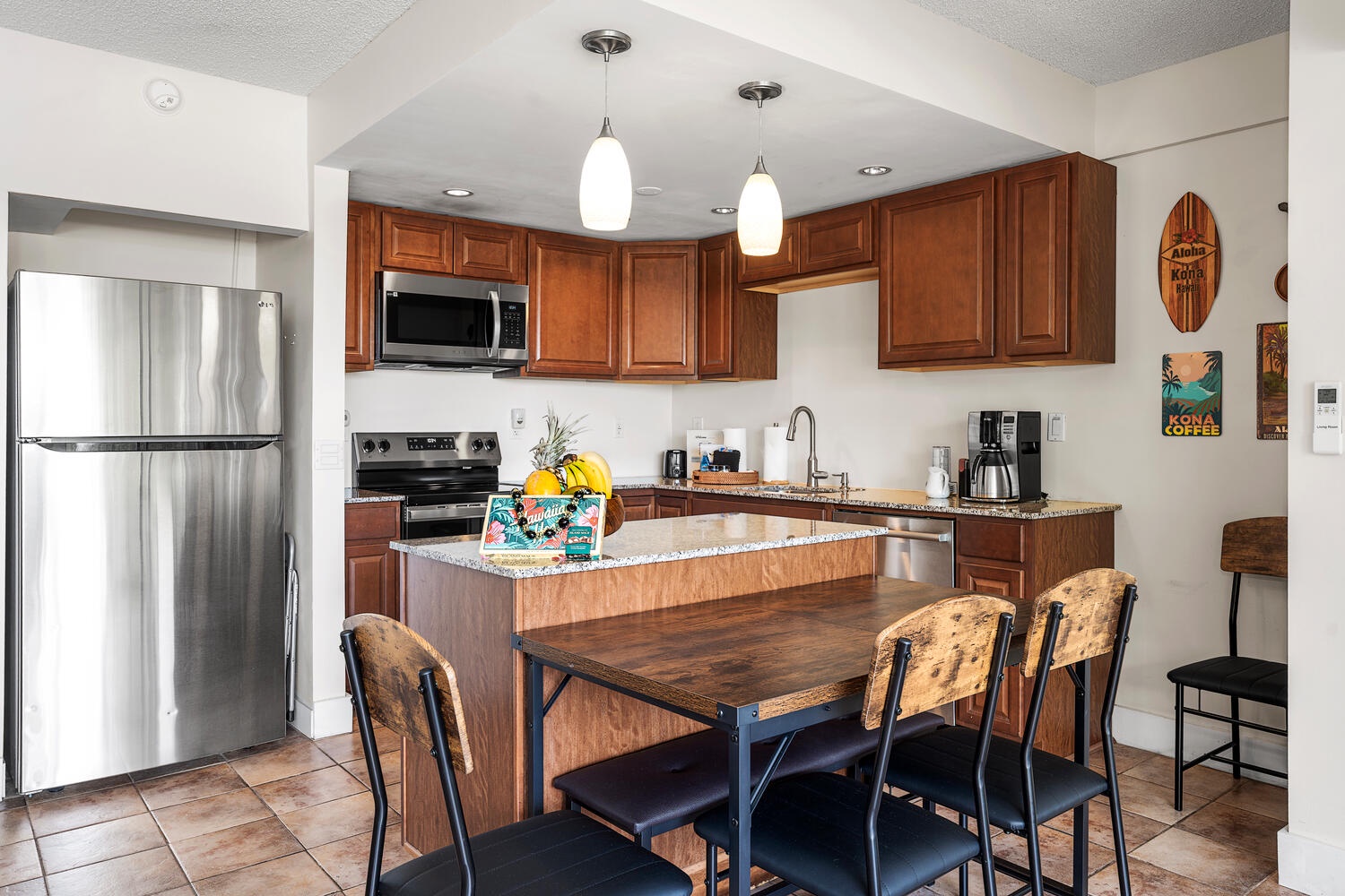 Kailua Kona Vacation Rentals, Kona Plaza 201 - Features granite counters, stainless appliances, and a perfect dining island for morning coffee or evening meals together.