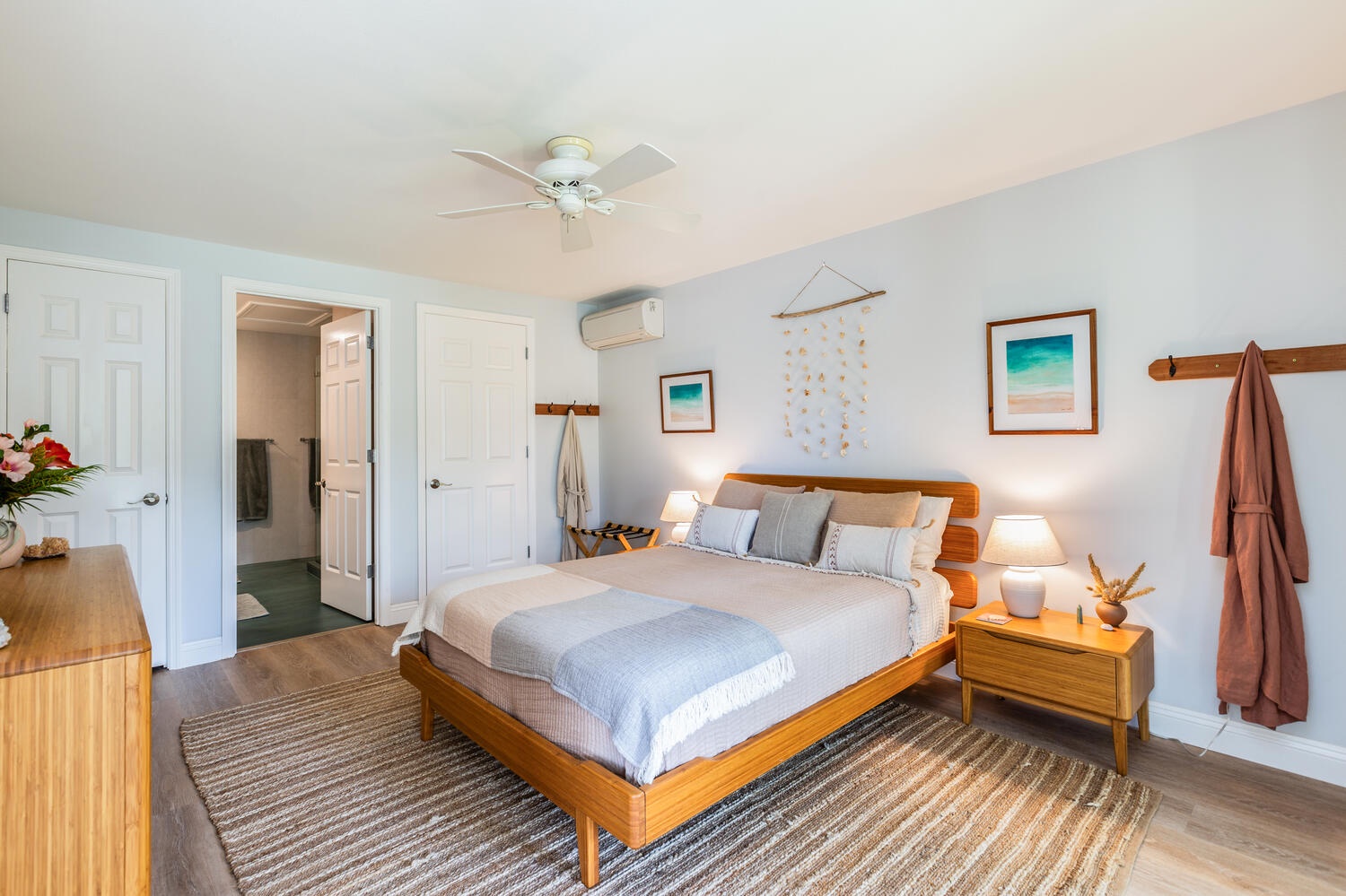 Princeville Vacation Rentals, Sea Glass - The second primary guest suite is in the main level with a queen bed.