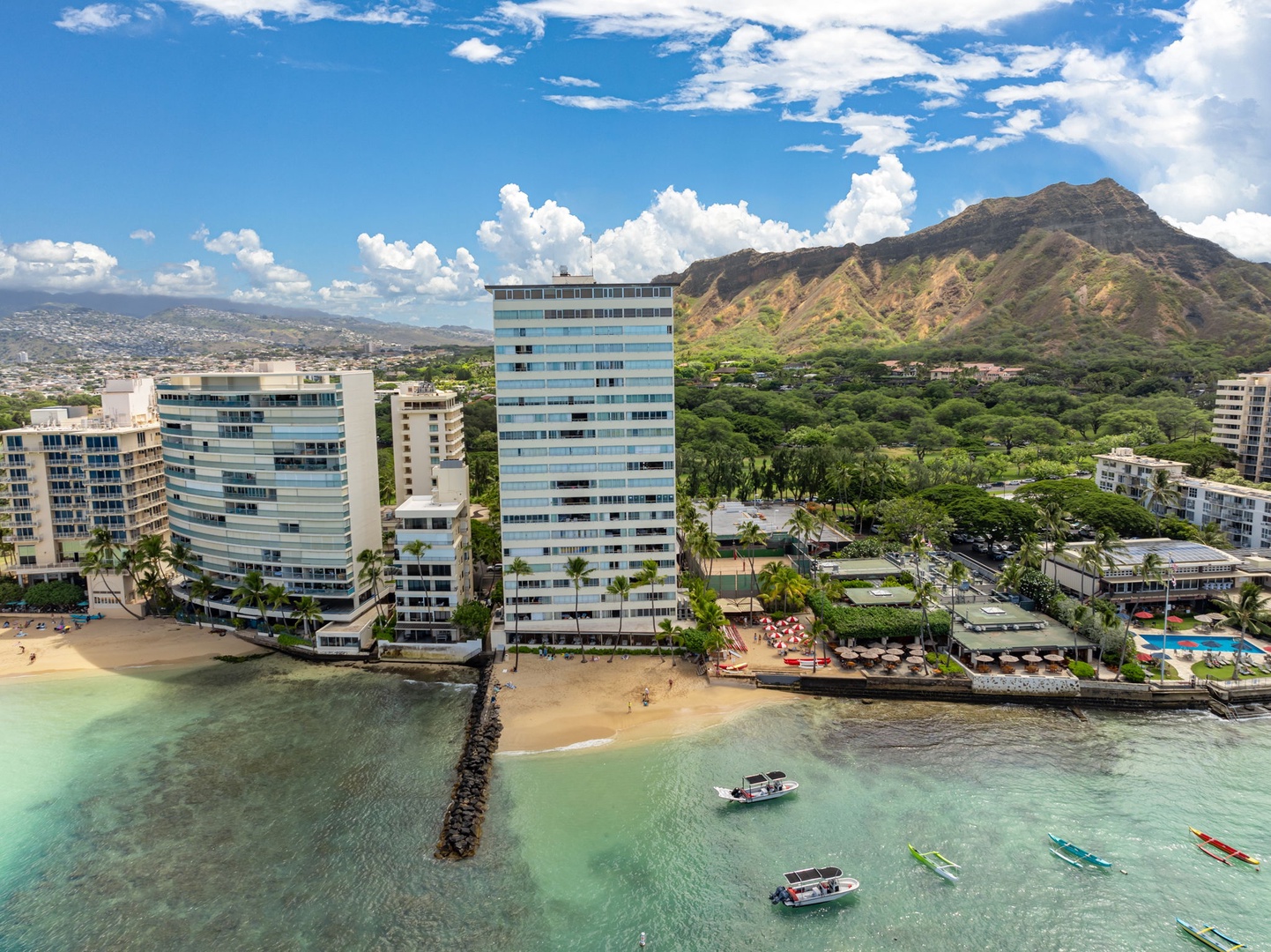 Honolulu Vacation Rentals, Colony Surf Getaway - Beautiful view of the property with Diamond Head in the background, combining coastal charm and iconic landmarks.