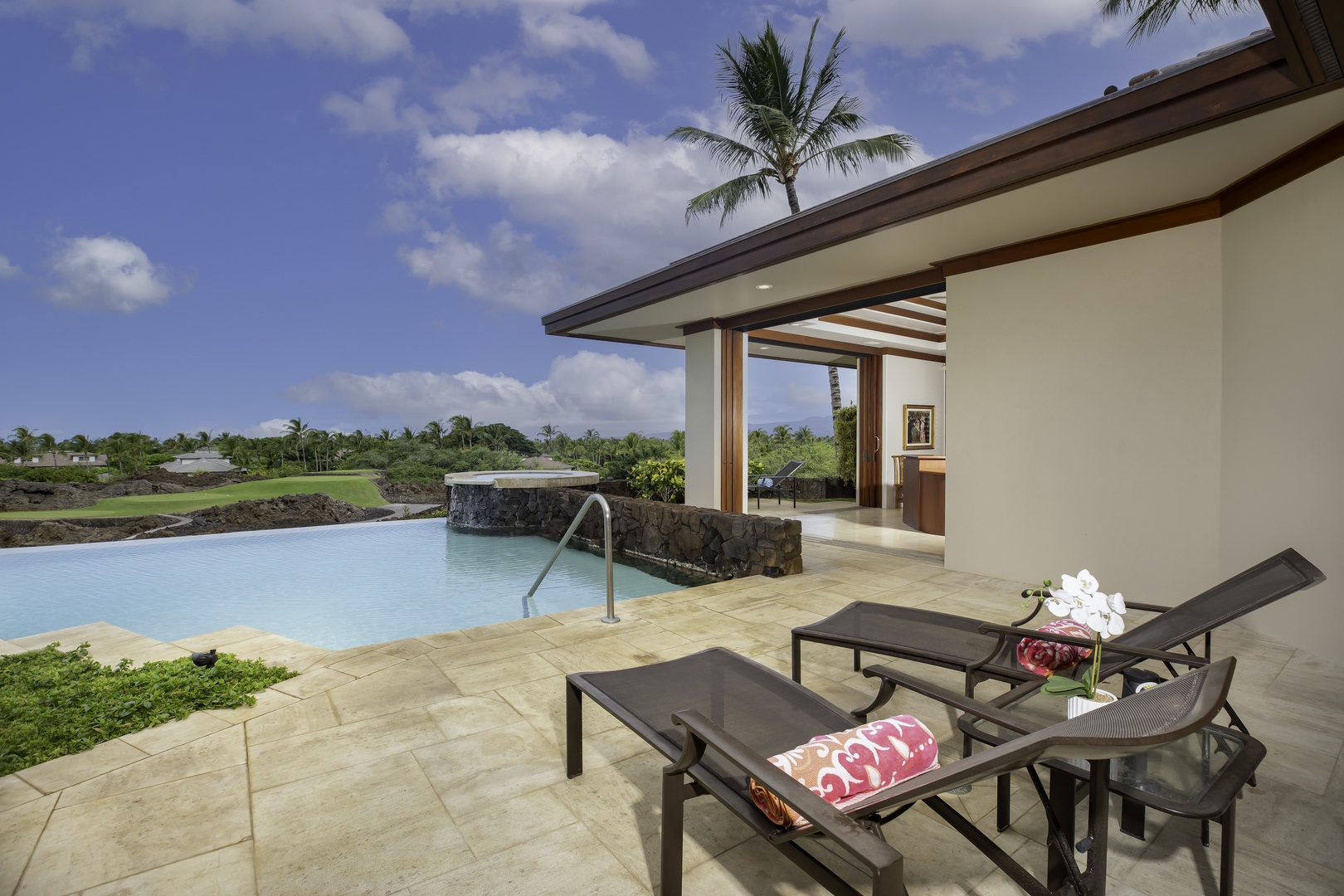 Kamuela Vacation Rentals, Champion Ridge 7 - Private infinity pool blends seamlessly with lush tropical views and nearby golf course backdrop.