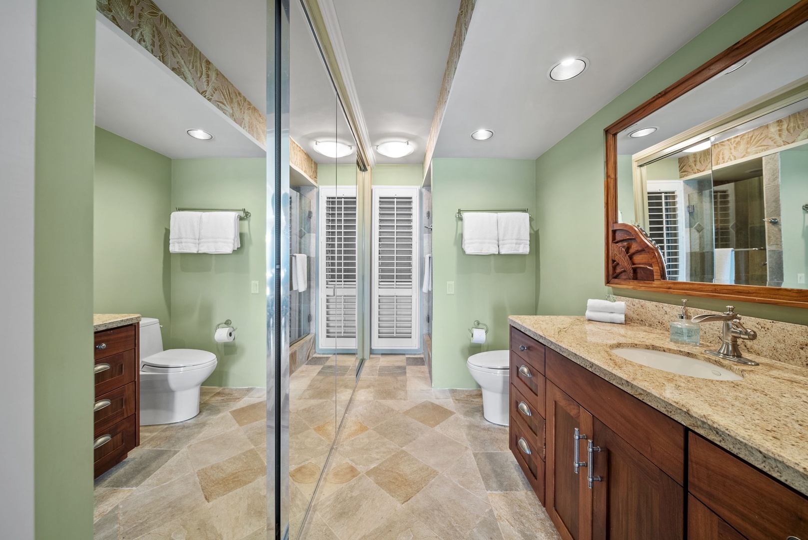 Honolulu Vacation Rentals, Colony Surf #1403 - Spacious bathroom with elegant finishes, dual sinks, and a walk-in shower for a refreshing start or end to your day.