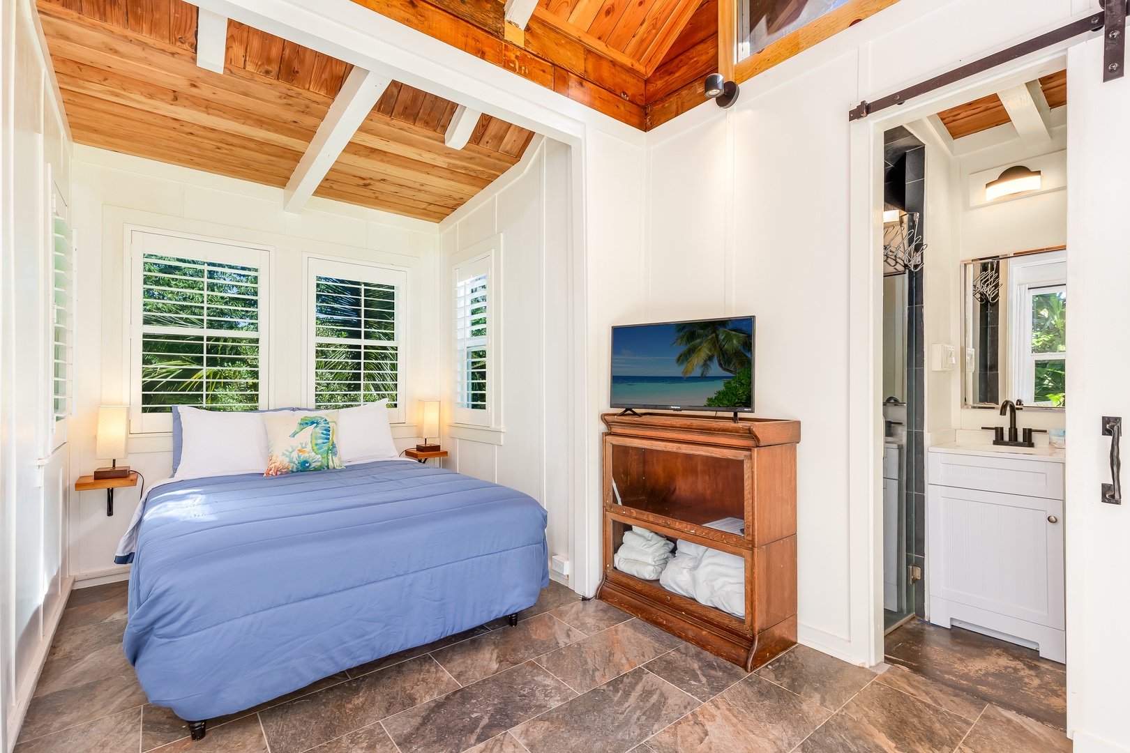 Haleiwa Vacation Rentals, Mele Makana - Guest bedroom 8 provides a Smart TV and private bathroom ensuite with shower stall