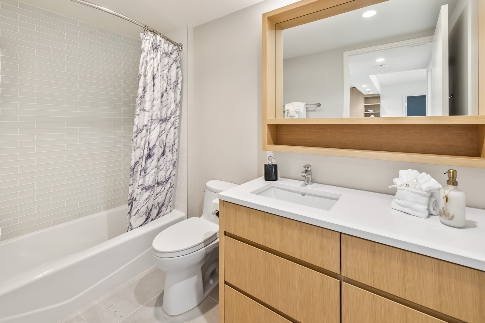 Honolulu Vacation Rentals, Sky Ala Moana #1701 - The ensuite bath has a single vanity and shower and tub combo.