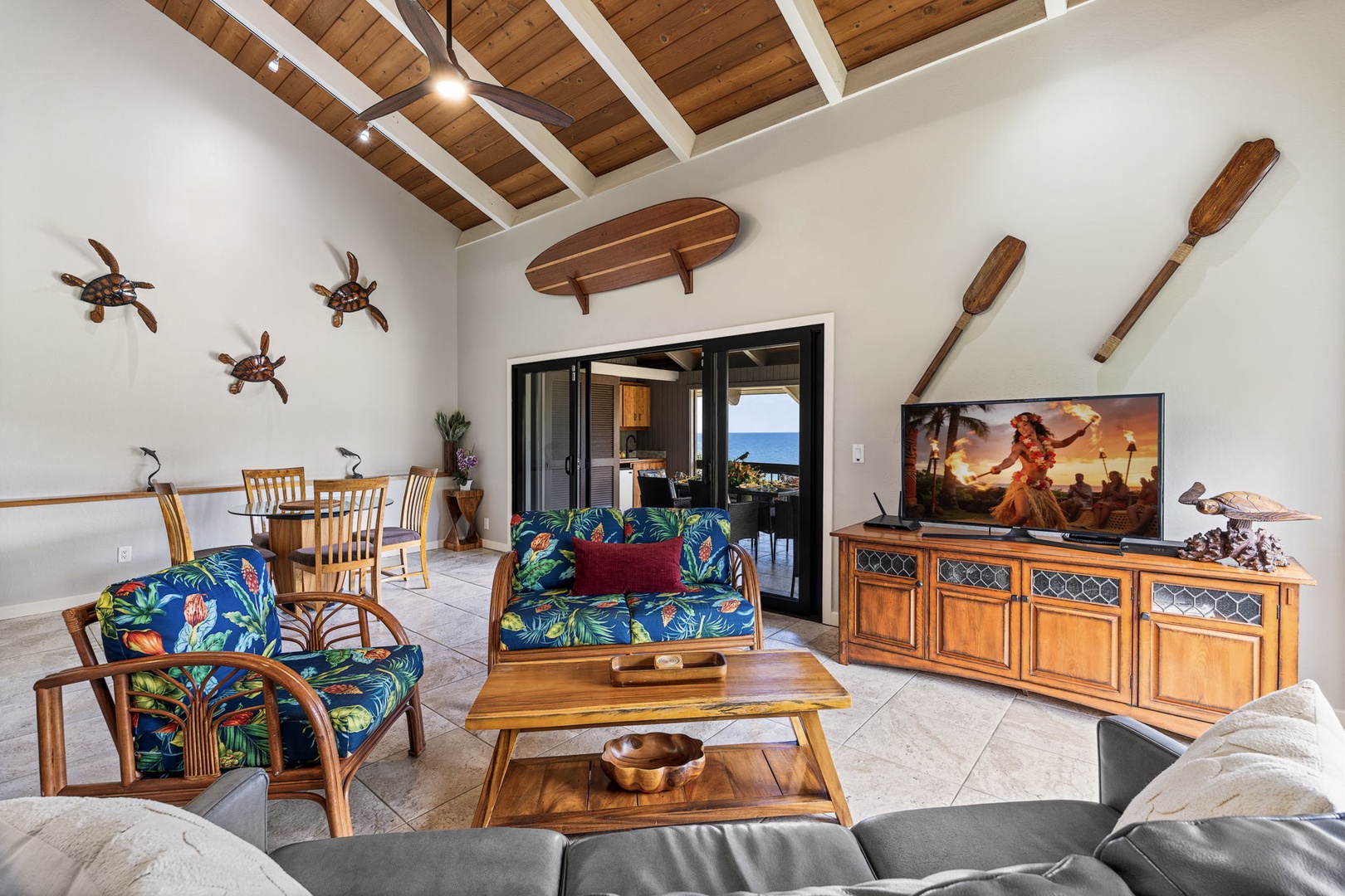 Kailua Kona Vacation Rentals, Kanaloa at Kona 1606 - Vaulted wood-beam ceilings give the living room room to breathe, tropical prints and all.
