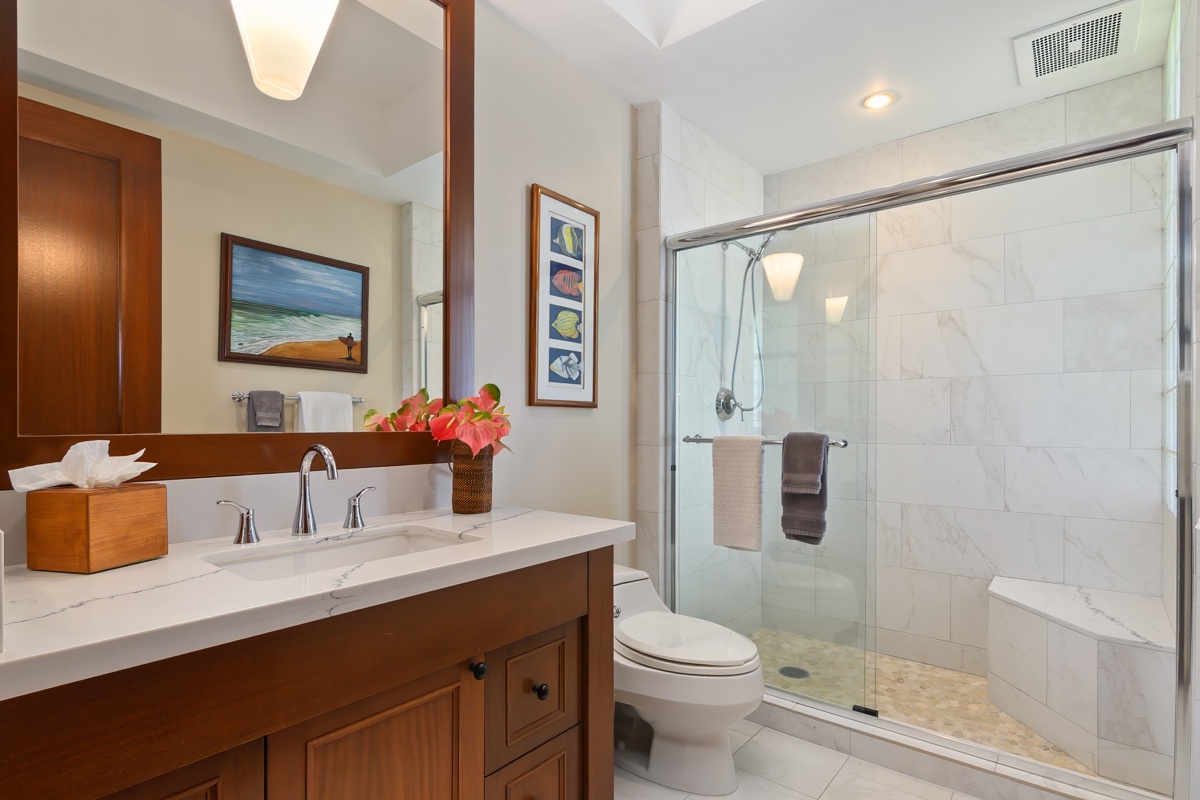 Kailua Kona Vacation Rentals, Fairways Villa 120A - Unwind in this spa-like bathroom with marble shower, soaking tub, and warm wood vanity creating your private sanctuary.