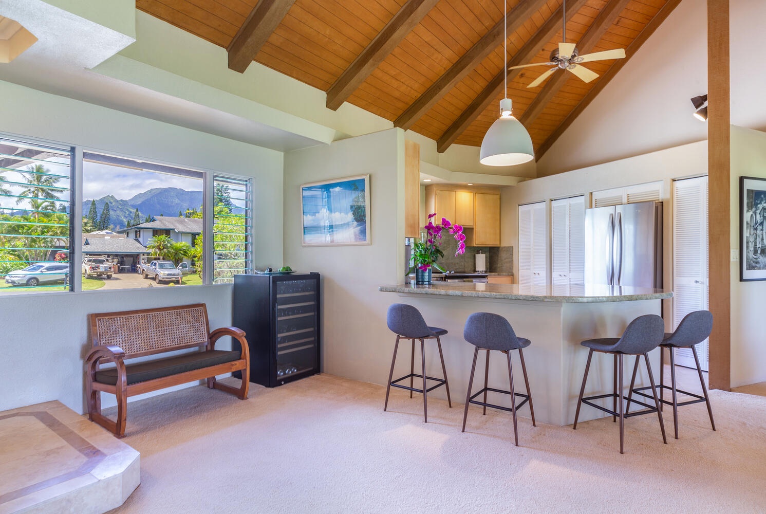 Princeville Vacation Rentals, Wai Puna - The fully equipped kitchen comes with a number of stainless steel appliances, storage space, and Granite countertops with a bar area and 4 stools