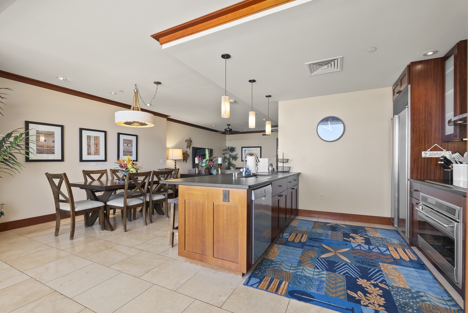 Kapolei Vacation Rentals, Ko Olina Beach Villas O1404 - Gather at the dining table with the kitchen island an easy reach behind.