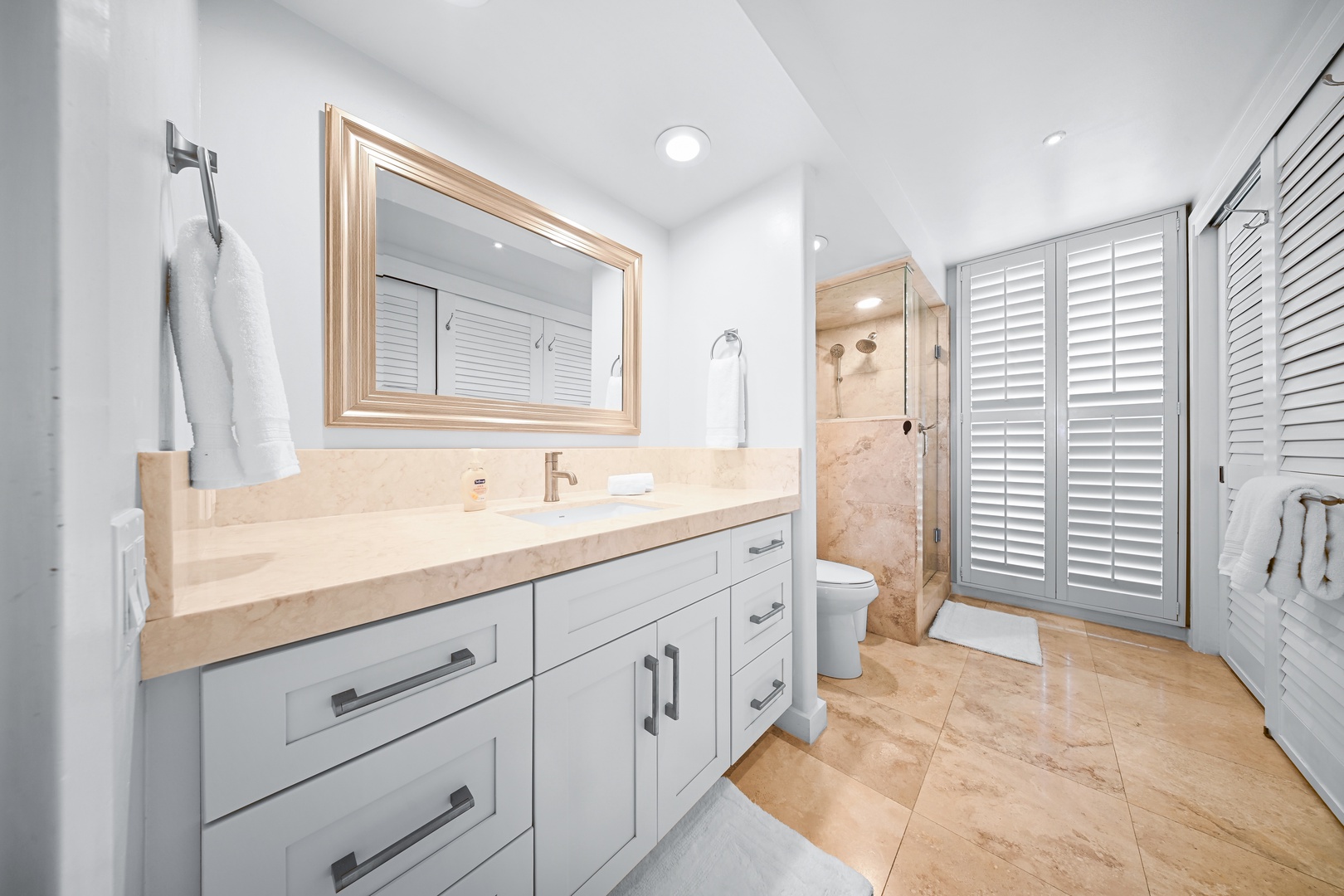 Honolulu Vacation Rentals, Kaimana Shores Getaway - Refresh in the spacious bathroom featuring an oversized vanity with plenty of room to prepare for the day.