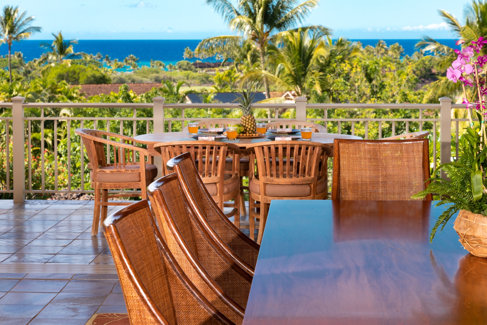 Kailua Kona Vacation Rentals, 3BD Ke Alaula Villa (210A) at Four Seasons Resort at Hualalai - Interior dining table through open floor to ceiling pocket doors to exterior dining table.