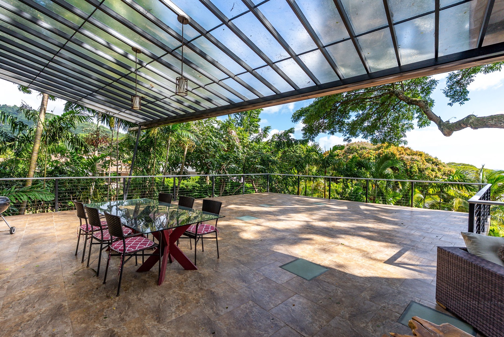 Honolulu Vacation Rentals, Tantalus Glass House (3 BD) - Savor your morning coffee under this glass-covered lanai, where tropical breezes meet panoramic garden views in your private outdoor dining sanctuary.
