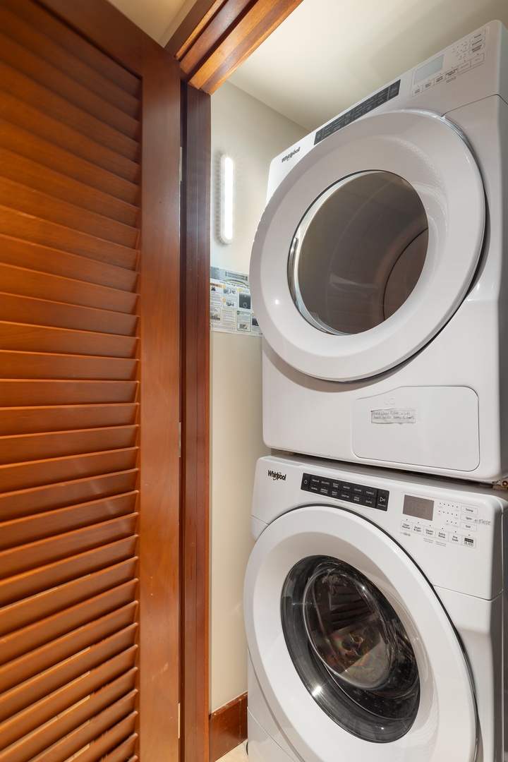 Kapolei Vacation Rentals, Ko Olina Beach Villas O1402 - A laundry nook with a stacked washer-dryer.